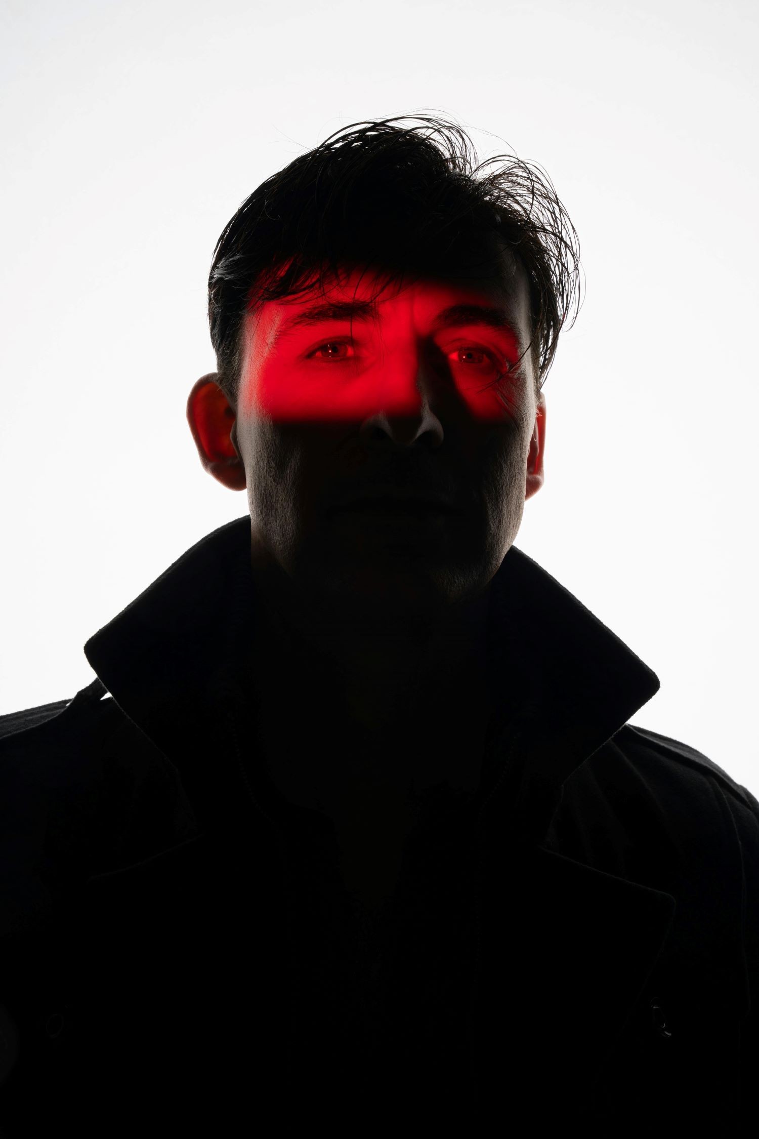 Creative man portrait with red lighting