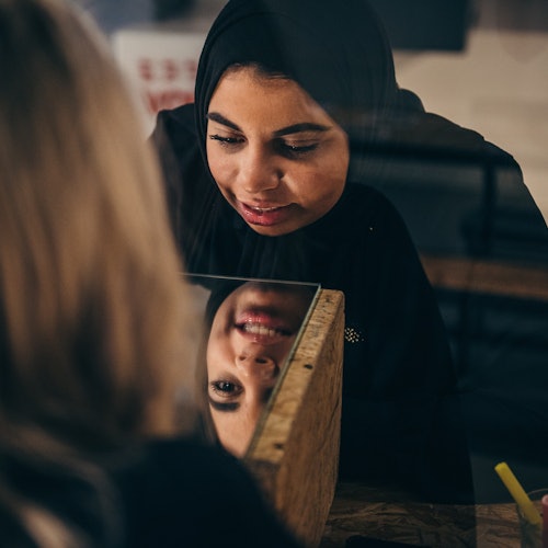 Visitors trying to draw themselves blind.