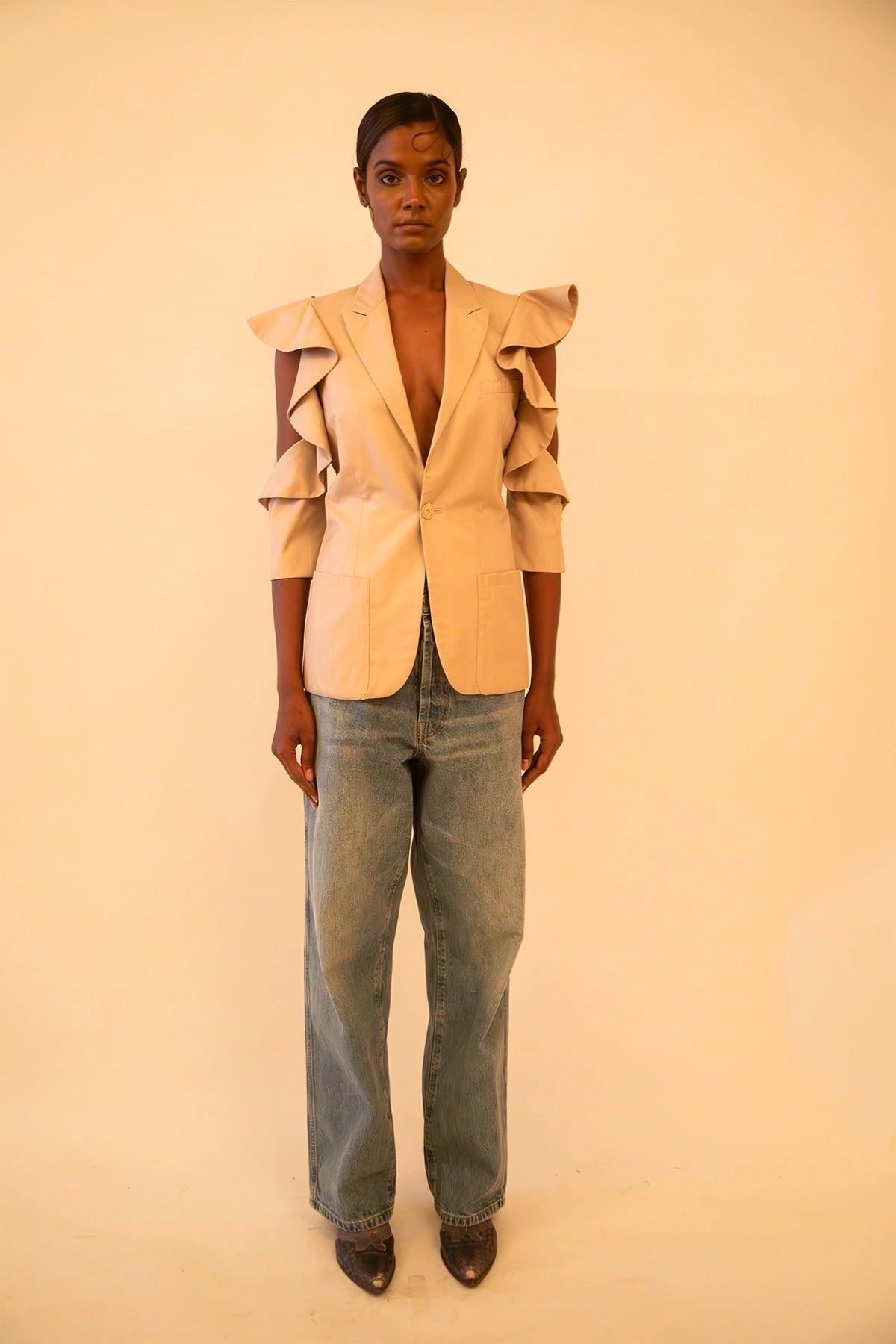 Vintage Jean Paul Gaultier fitted blazer with ruffle detailing and open shoulders, featuring sculpted tailoring and iconic archival design