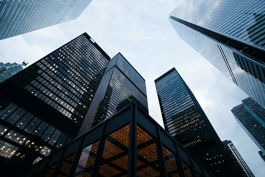 Photograph of skyscrapers from below.
