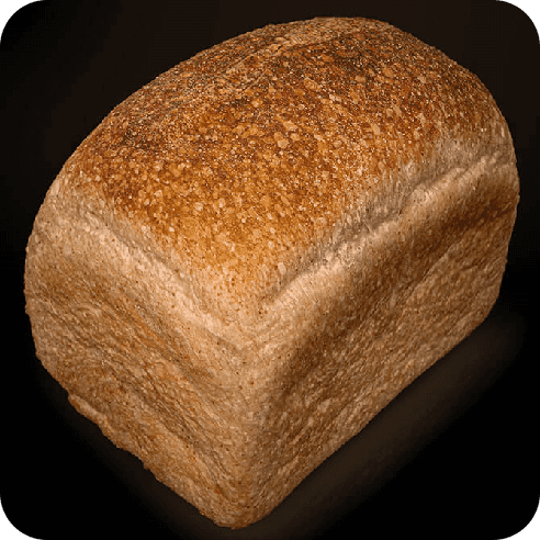 Pan de molde de masa madre entero, horneado artesanalmente, con corteza caramelizada y textura uniforme.