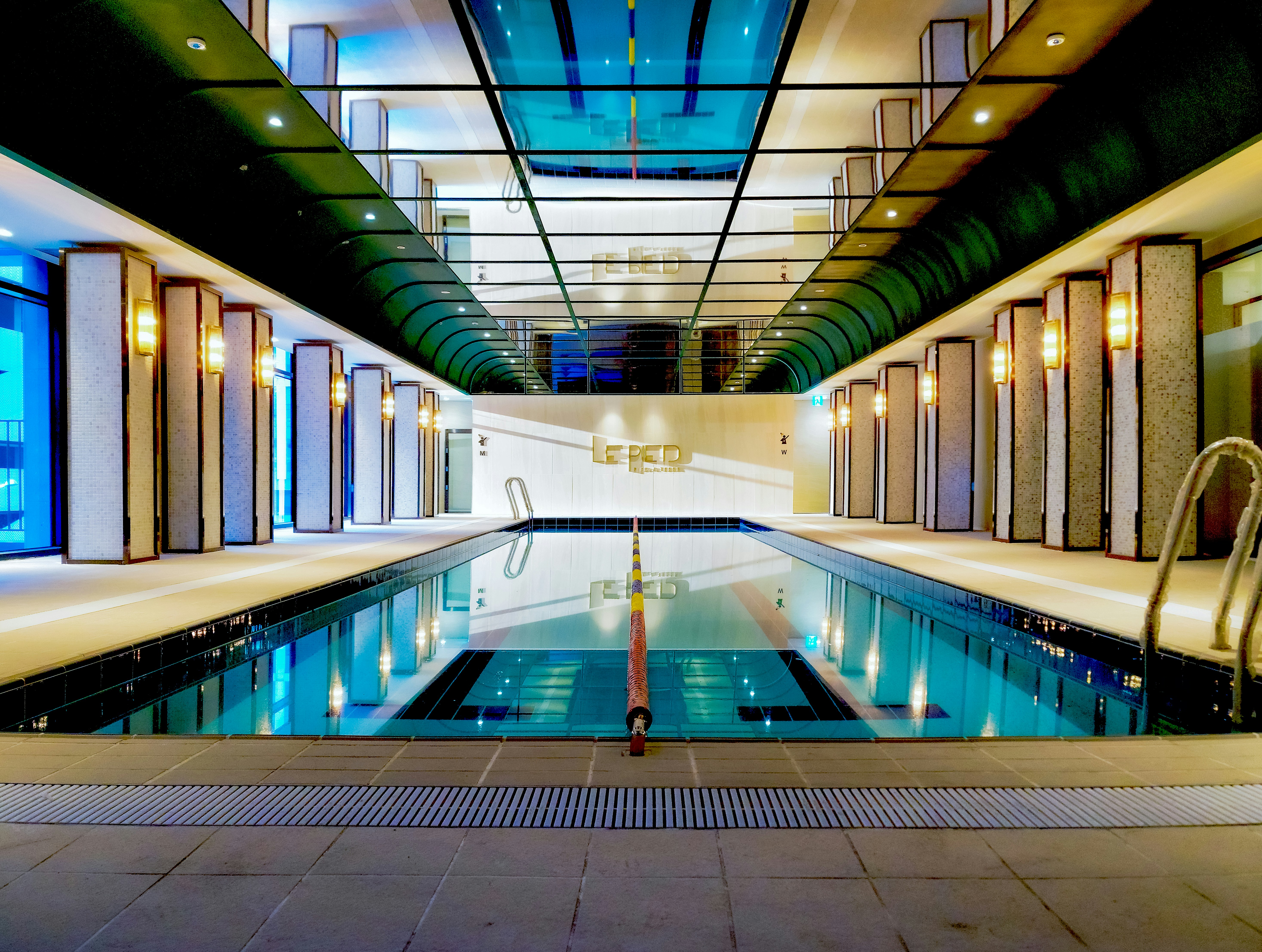 a swimming pool in a large indoor building
