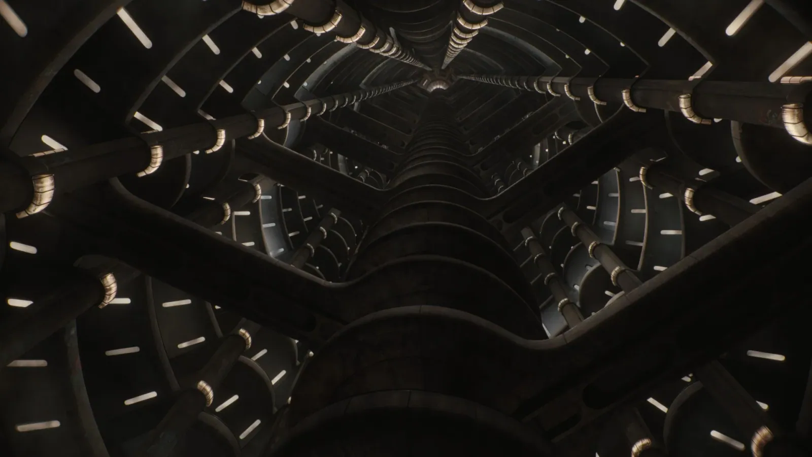 A futuristic, tunnel-like structure with intricate, symmetrical metal beams and glowing lights creating an industrial, sci-fi ambiance.