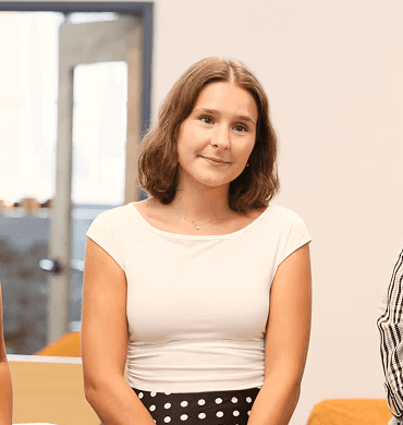 Resident of PEF's Teacher Residency program smiling at mentor.