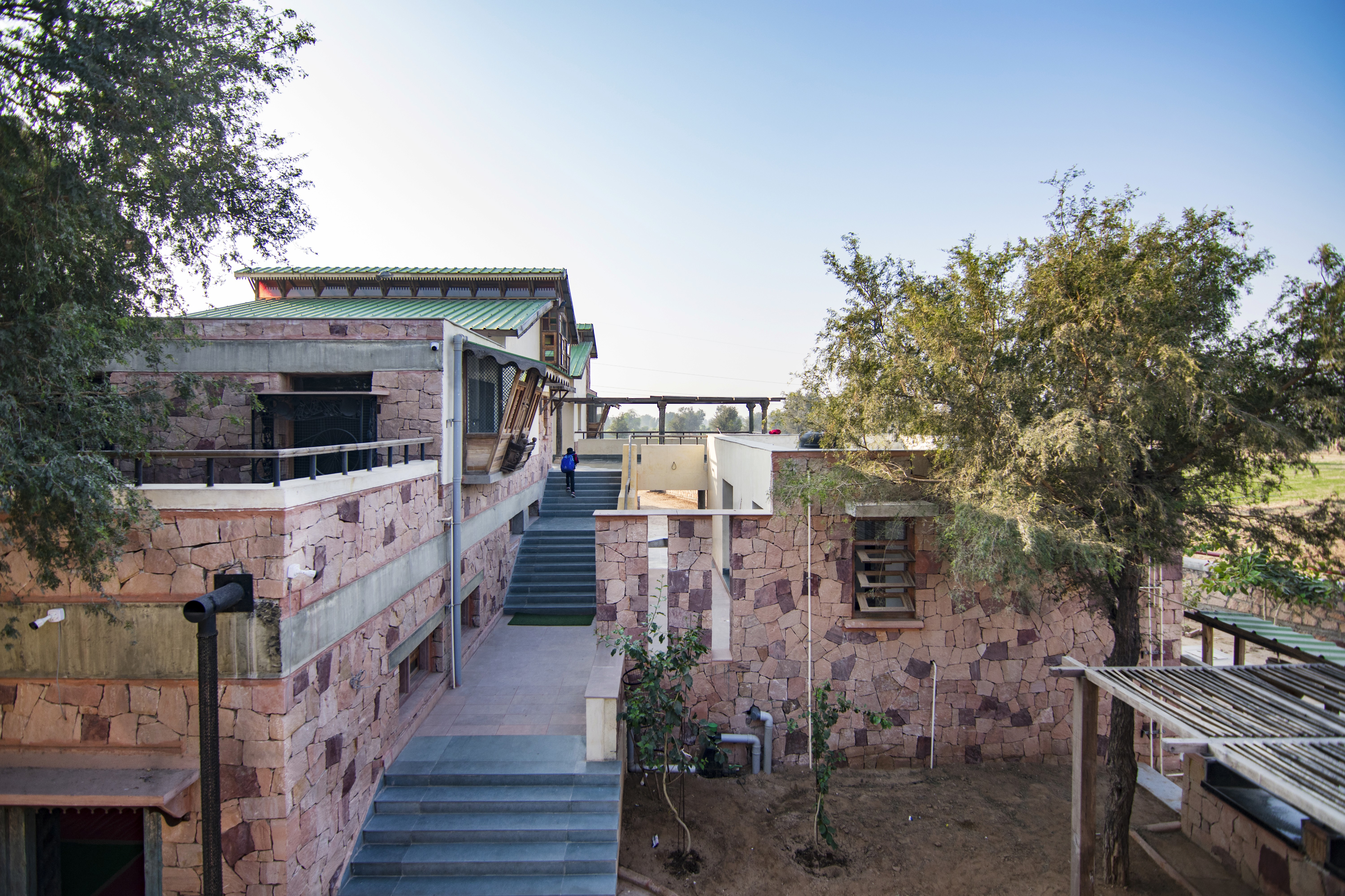 A student is writing in a notebook, focused on the task