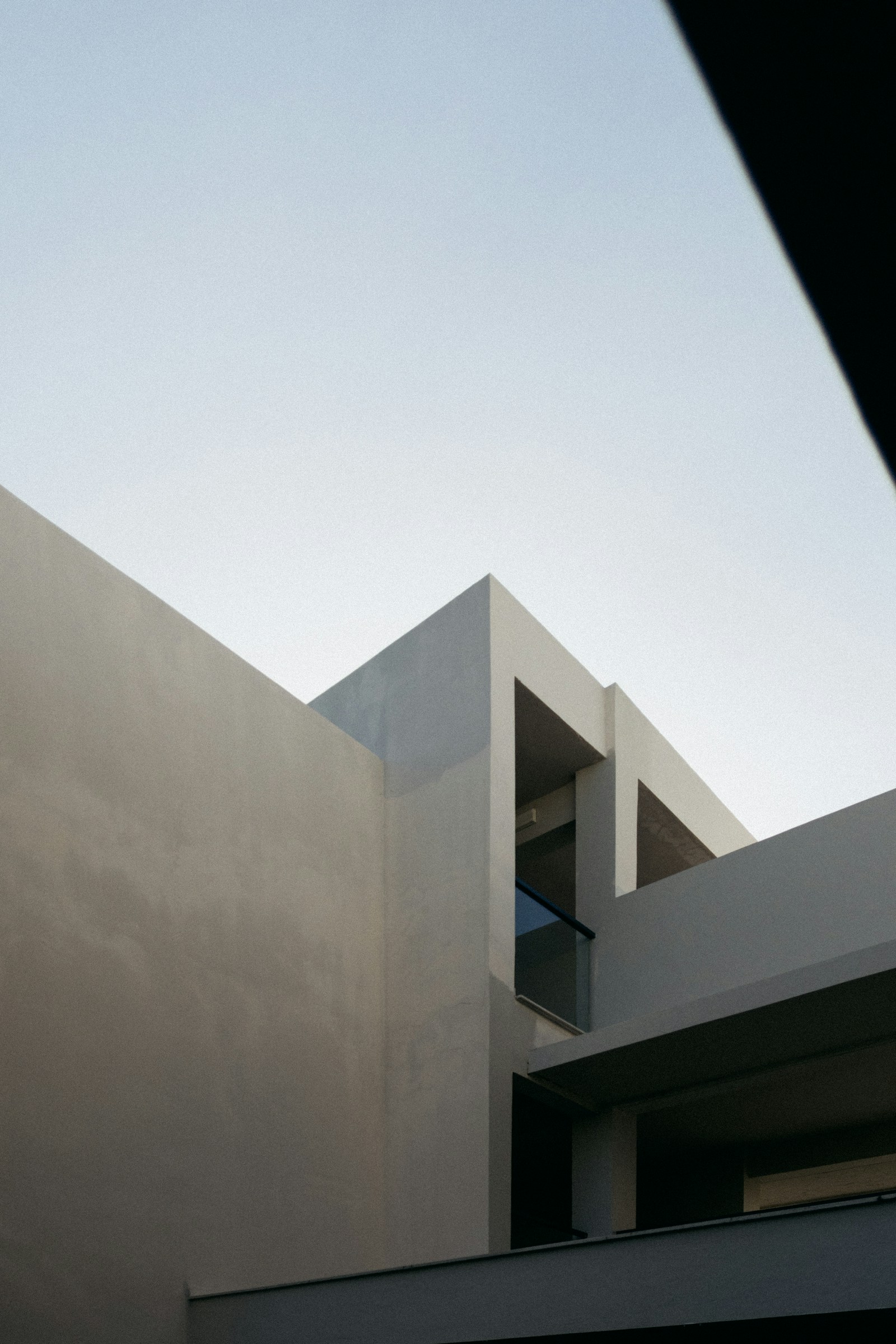 White concrete building against a blue sky