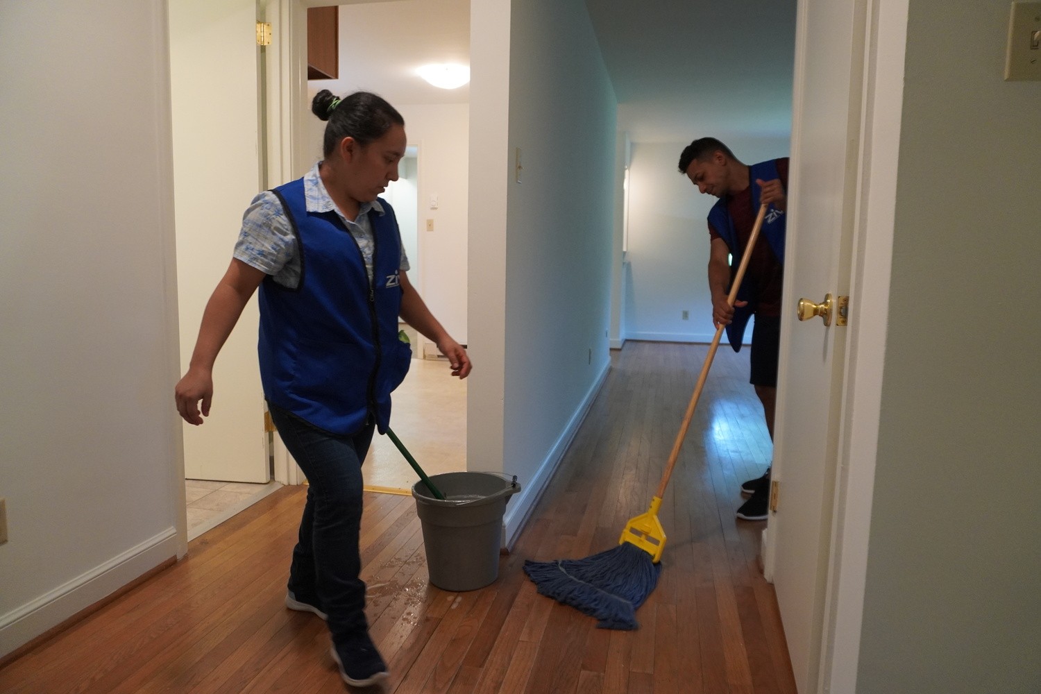 wooden floor being mopped by cleaning service company