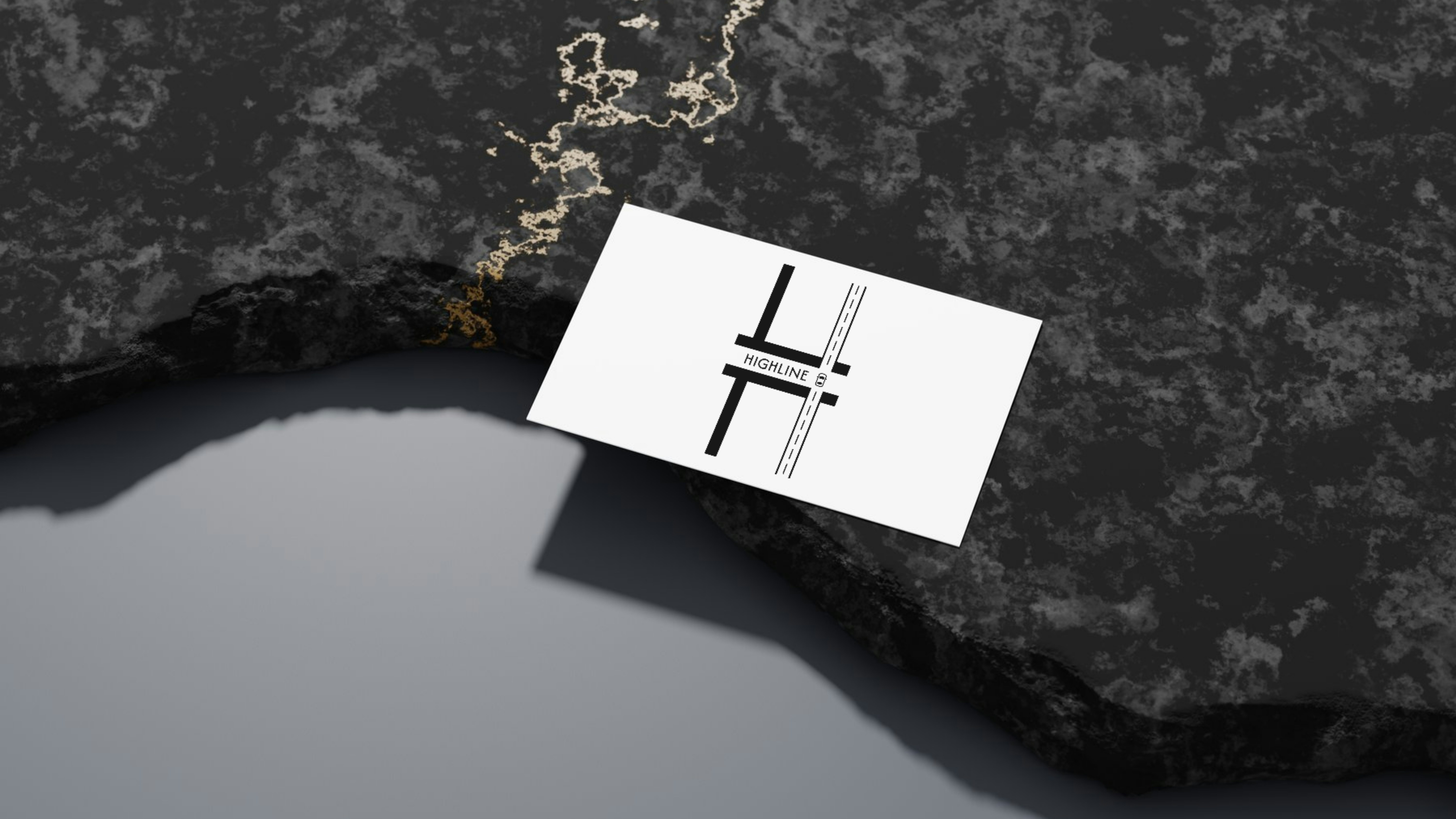 A business card sits on a textured surface.