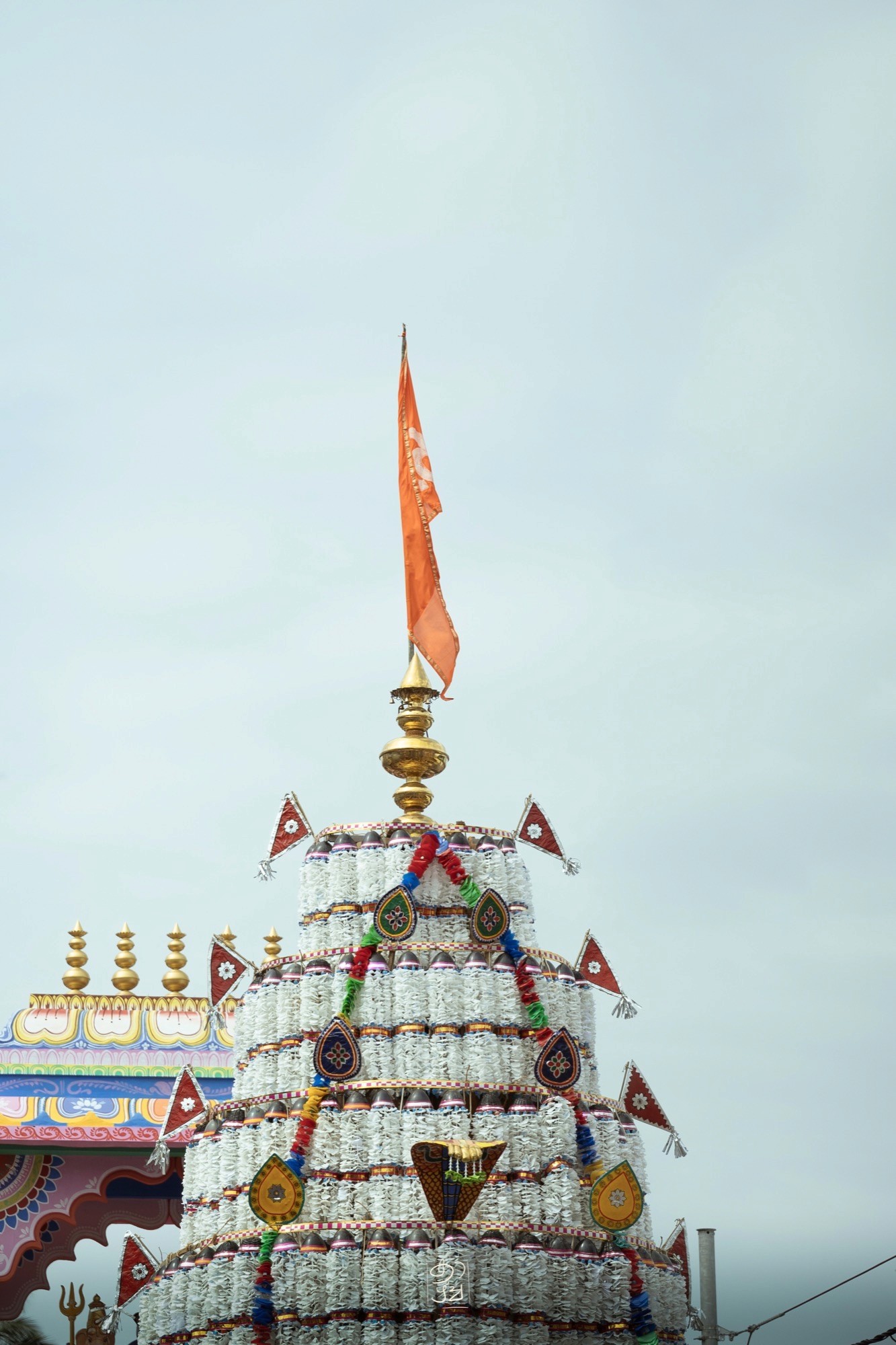 Gold finials and flags crowning the temple chariot