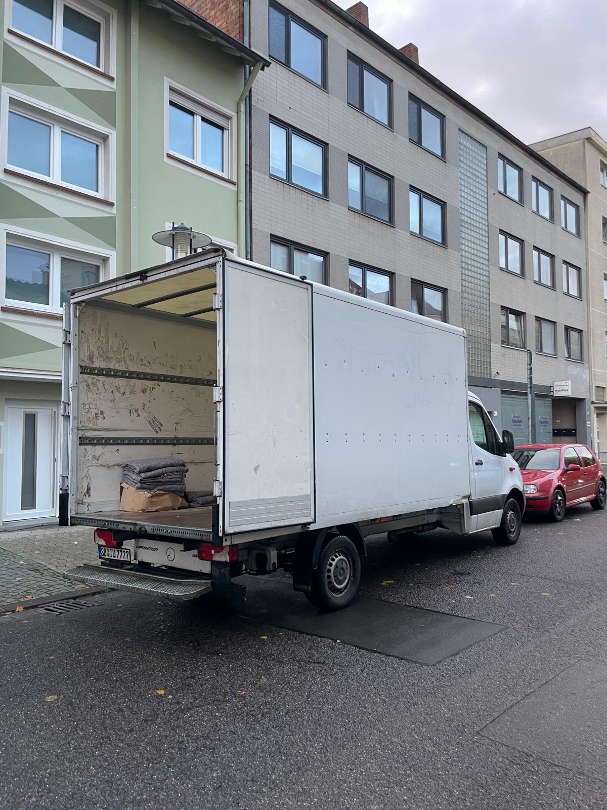 two men working on the roof of a house