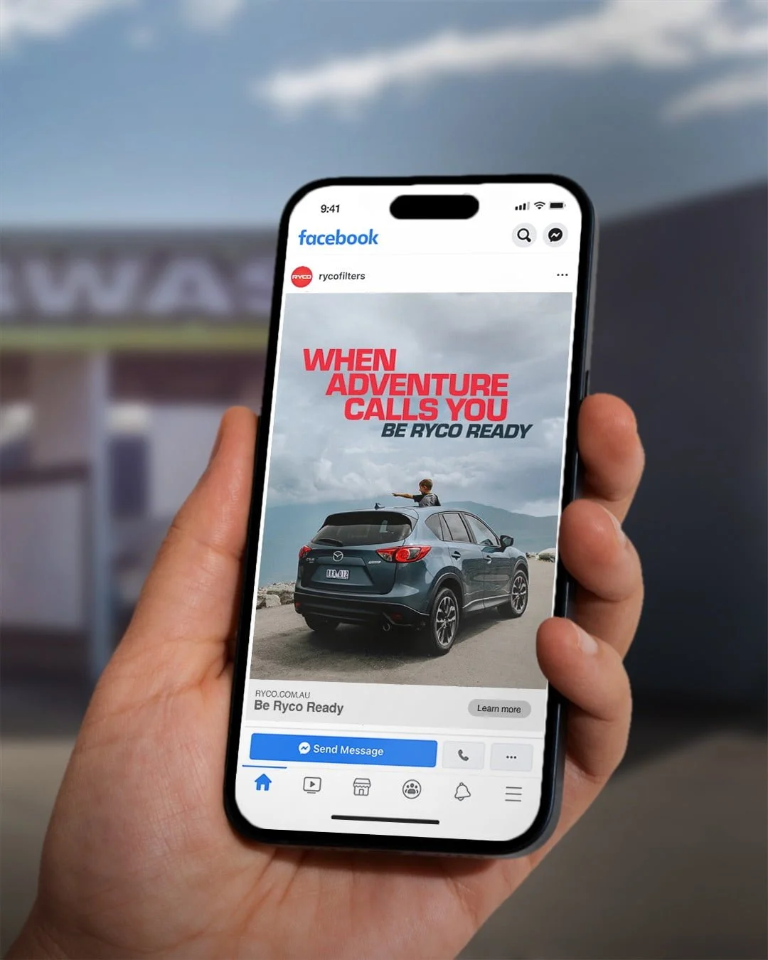 Phone showing a Ryco Facebook ad: 'When adventure calls you. Be Ryco ready.' with an SUV and a child on the roof