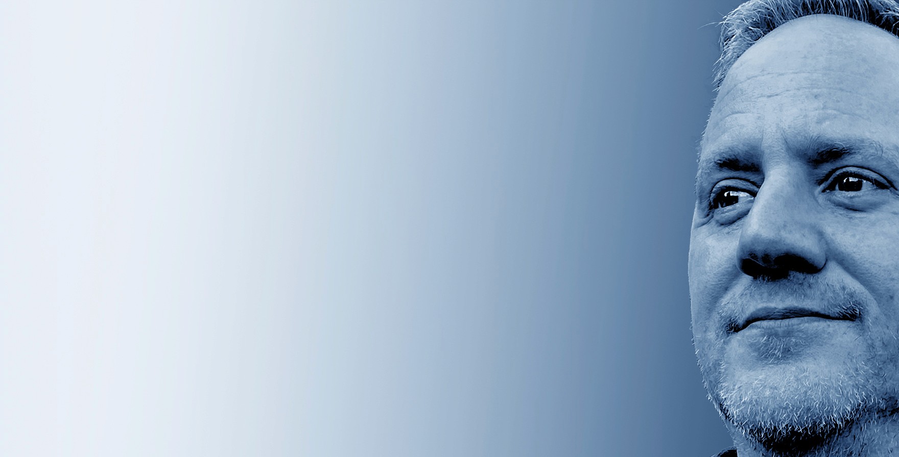 Grayscale close-up portrait of Jeremy J. McLean, Senior UX, Visual, and Motion Designer, featured in hero banner with gradient blue background.