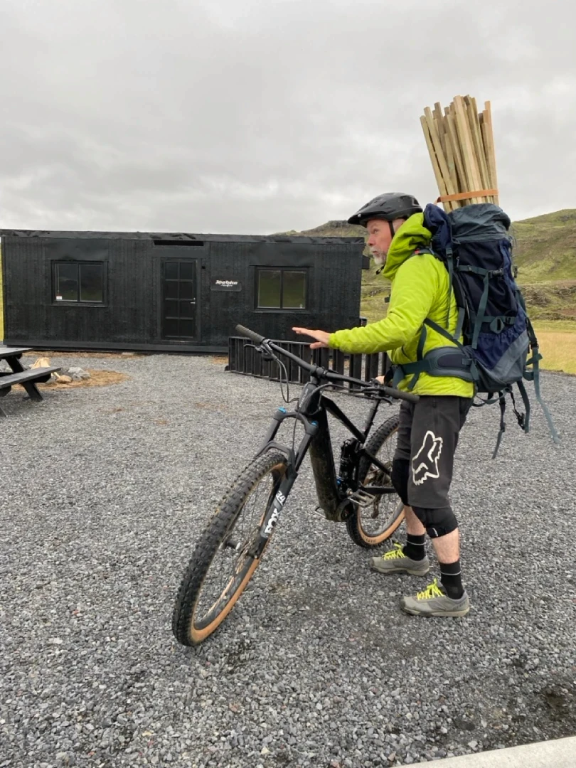 Magne Kvam on his way to trailbuilding with tools