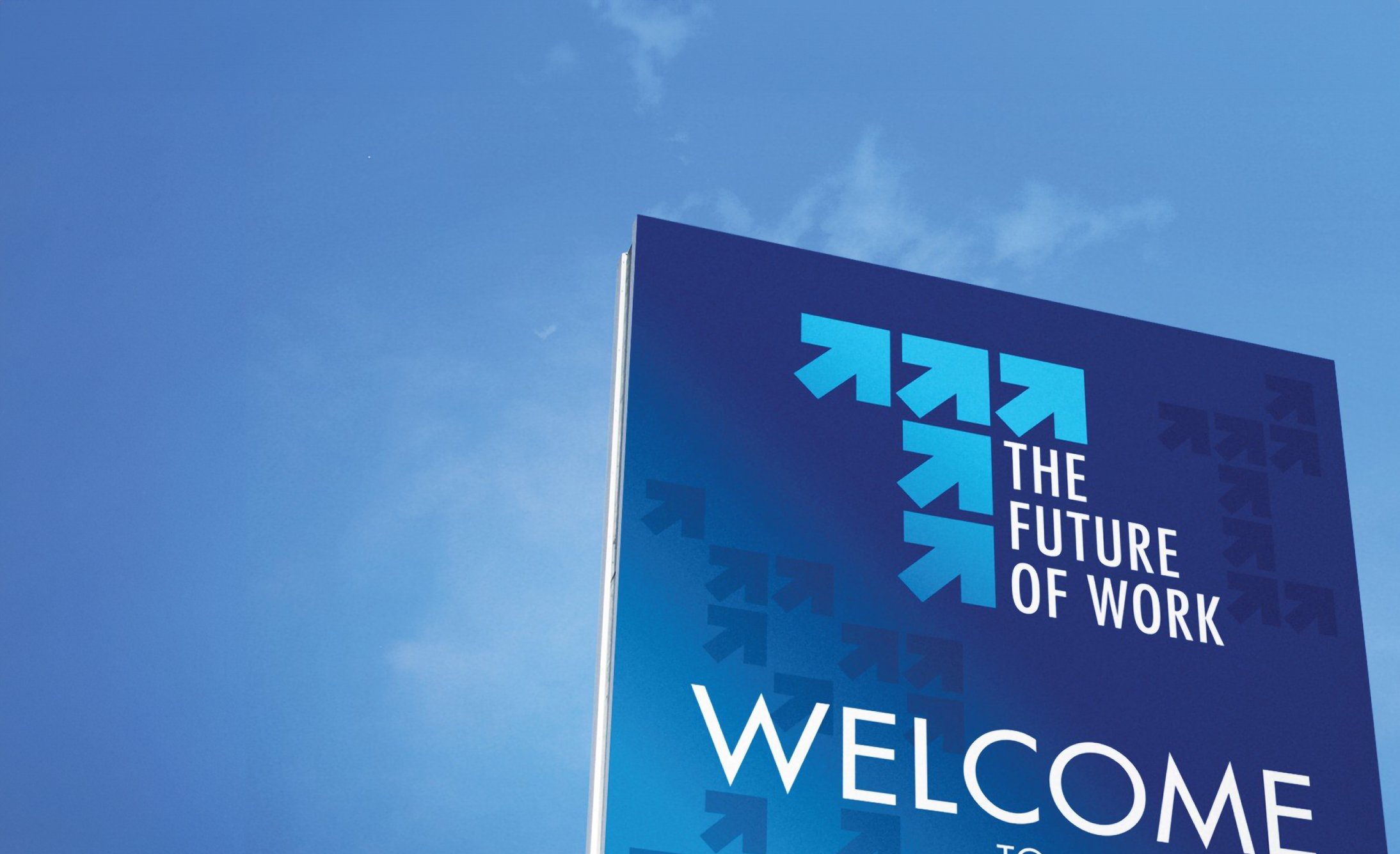Sign against a clear blue sky, featuring bold text "The Future of Work" with upward blue arrows, conveying progress and optimism.