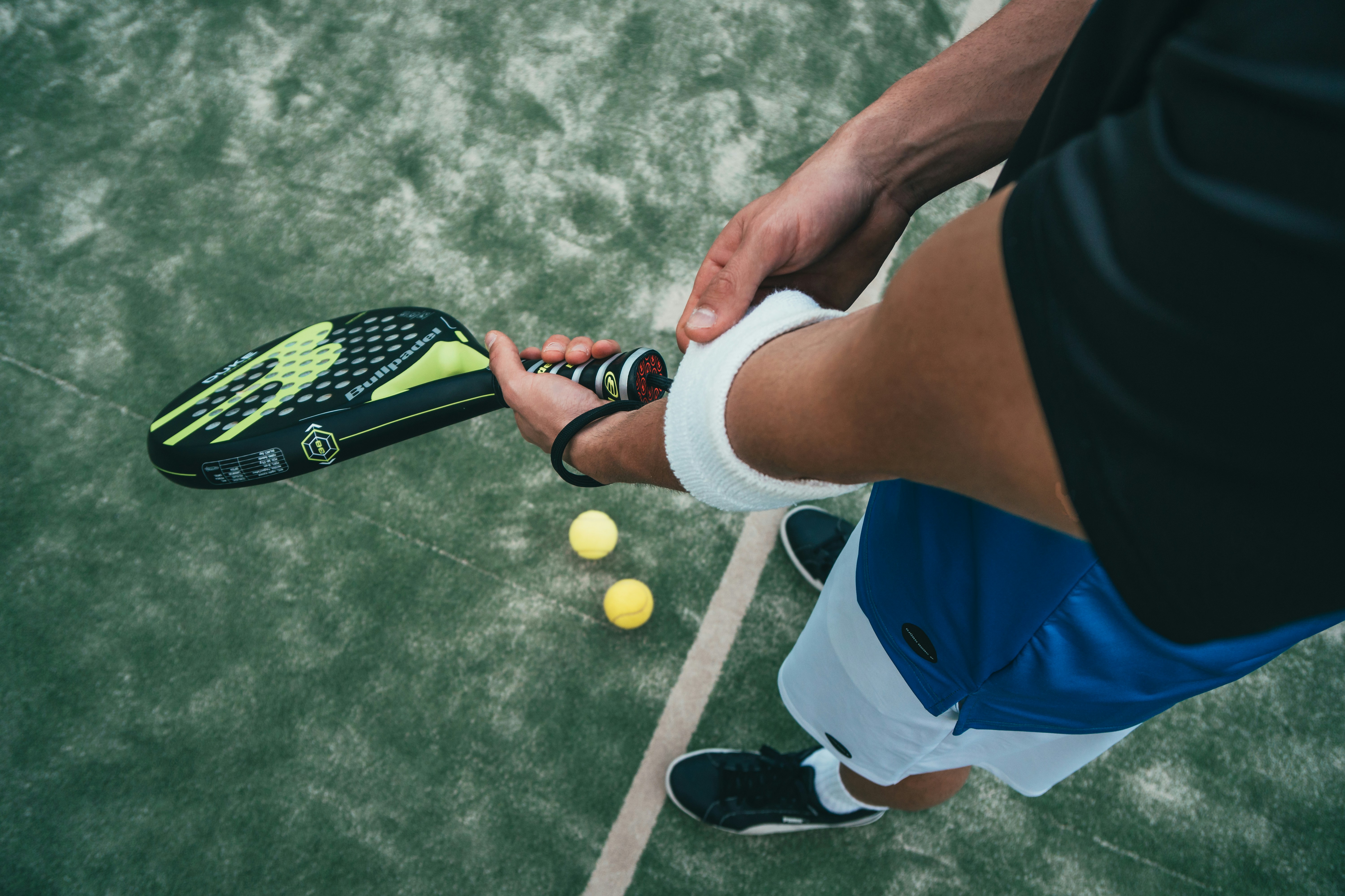 person holding a padel racket