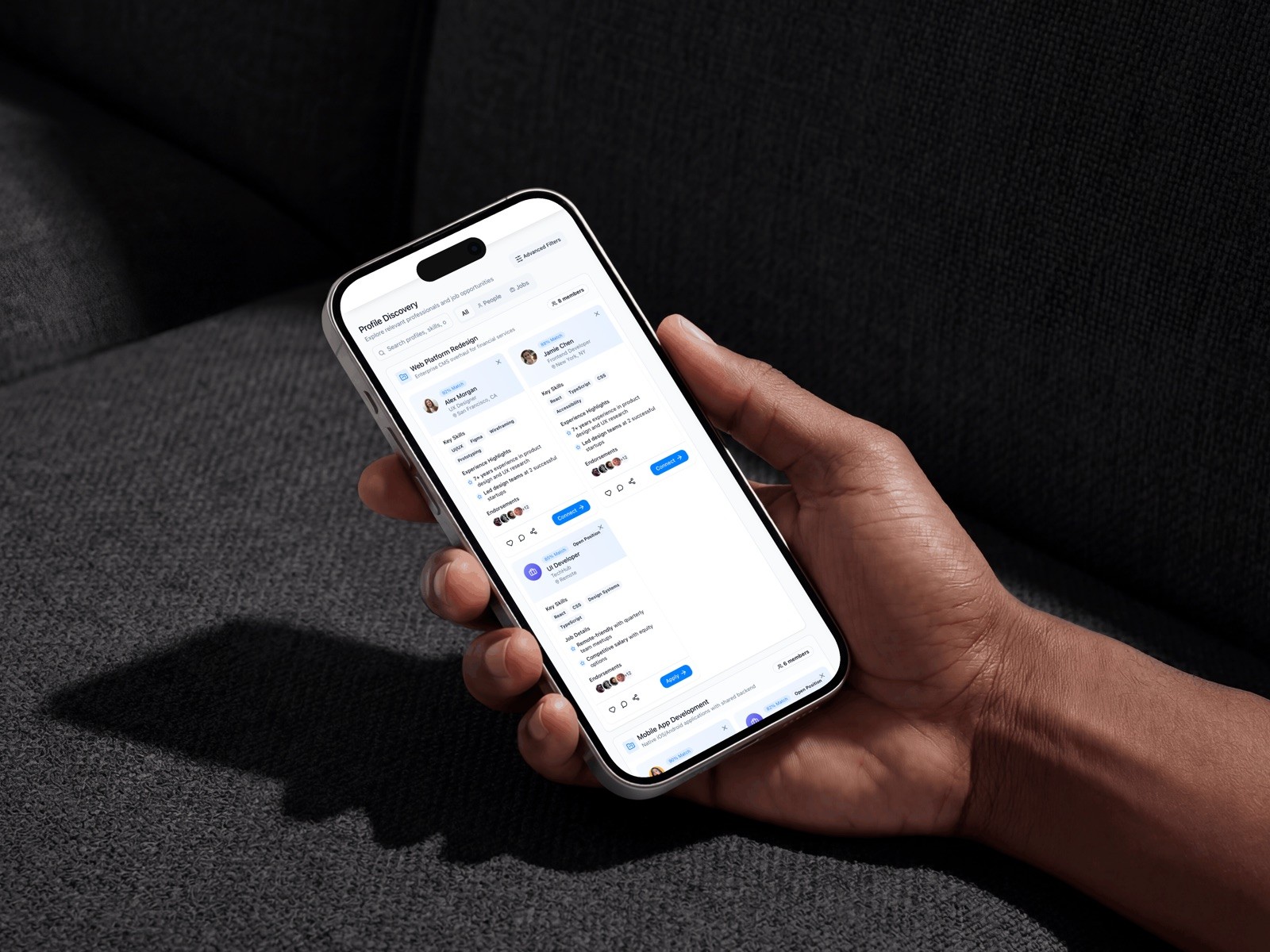 TalentFlow discovery feed on a phone held in one hand