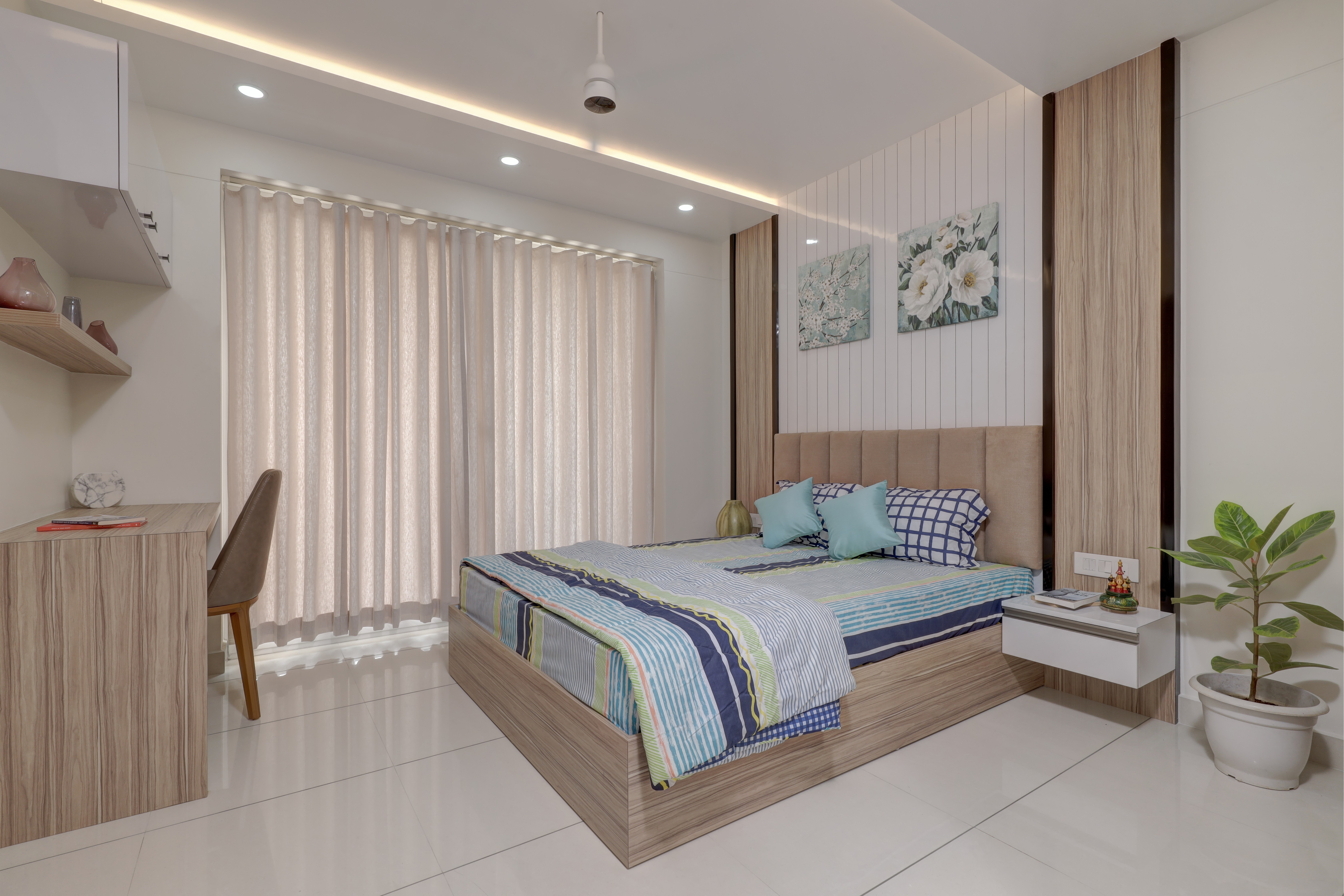 Futuristic sneaker with yellow, green, and orange accents, set against flowing fabric