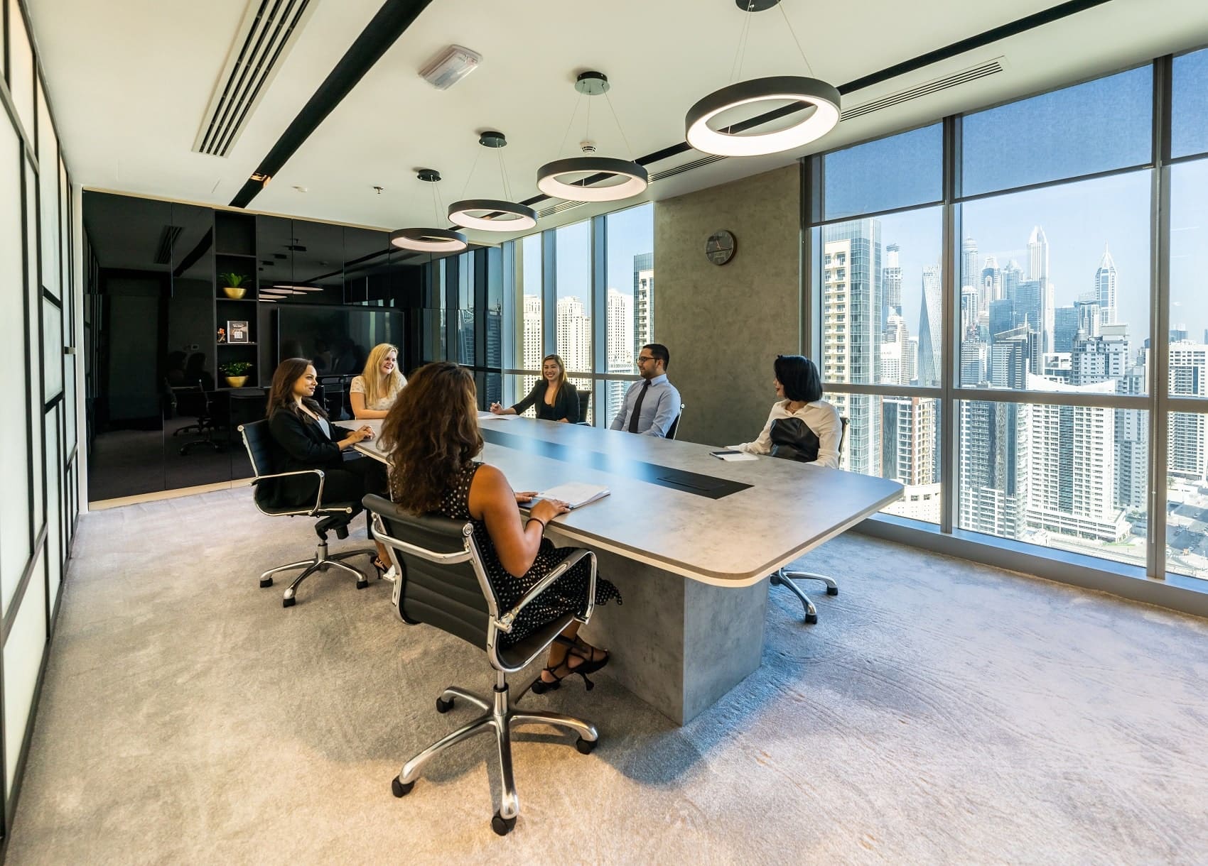 Company meeting in an office boardroom.