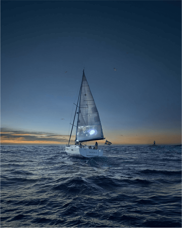 An image of a sailing boat on the ocean, someone is watching a movie on the sailing canvas