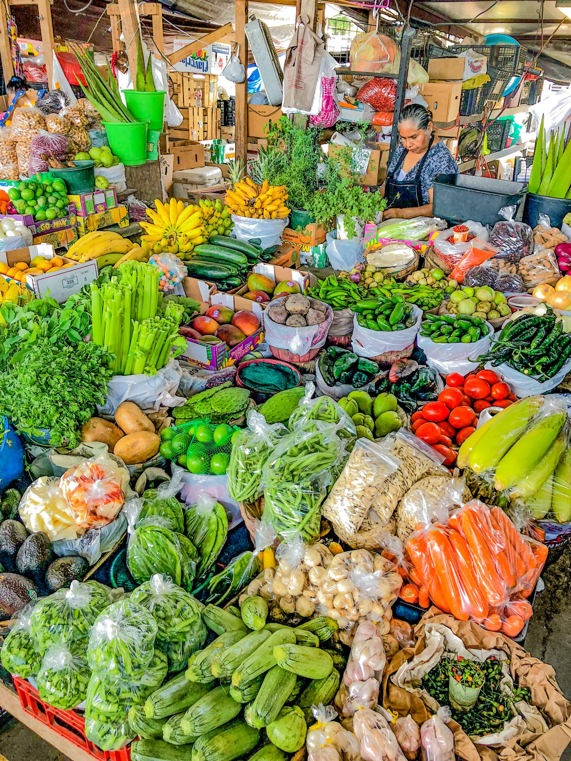 A farmers market bustling with people