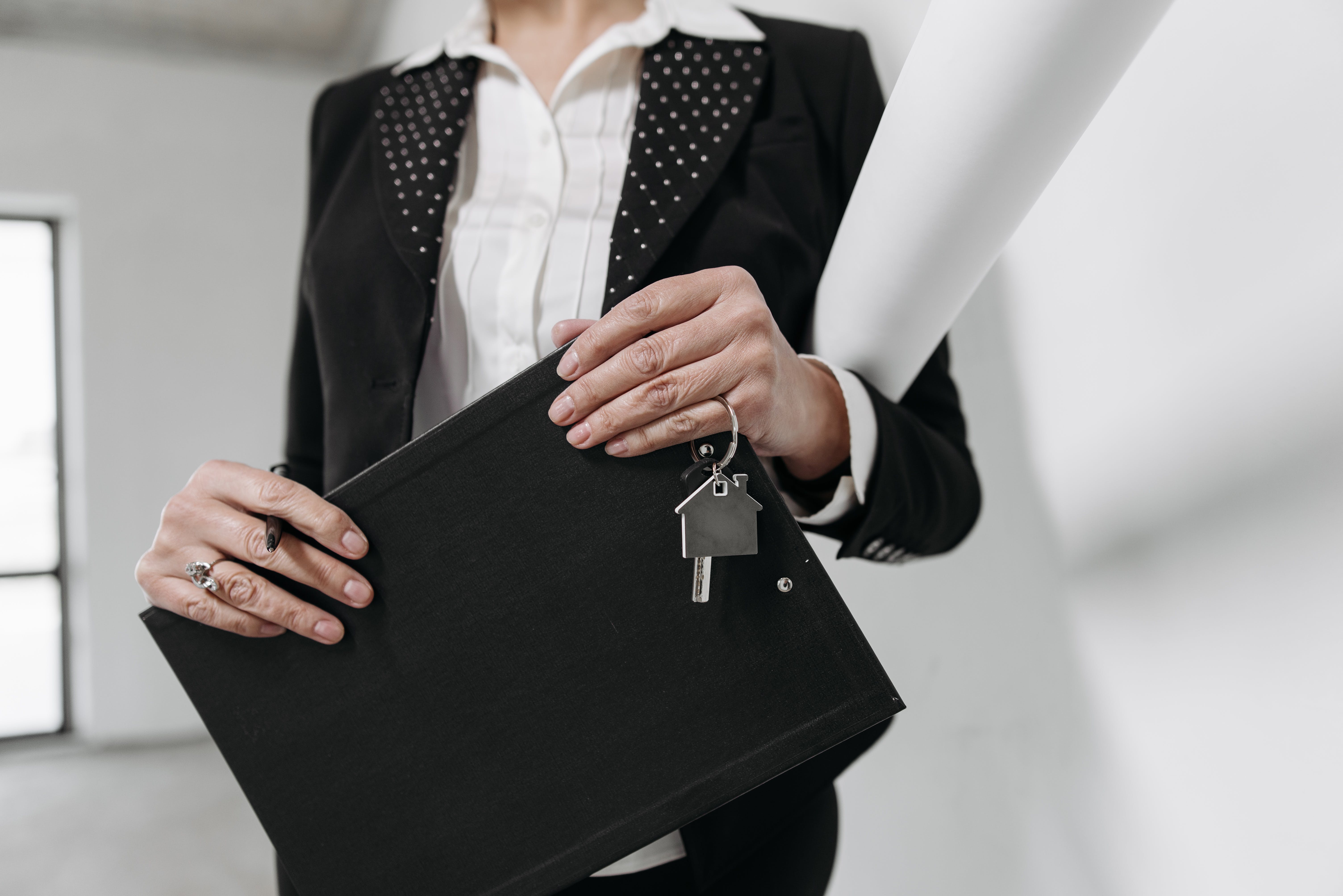 Mortgage broker holding a house key