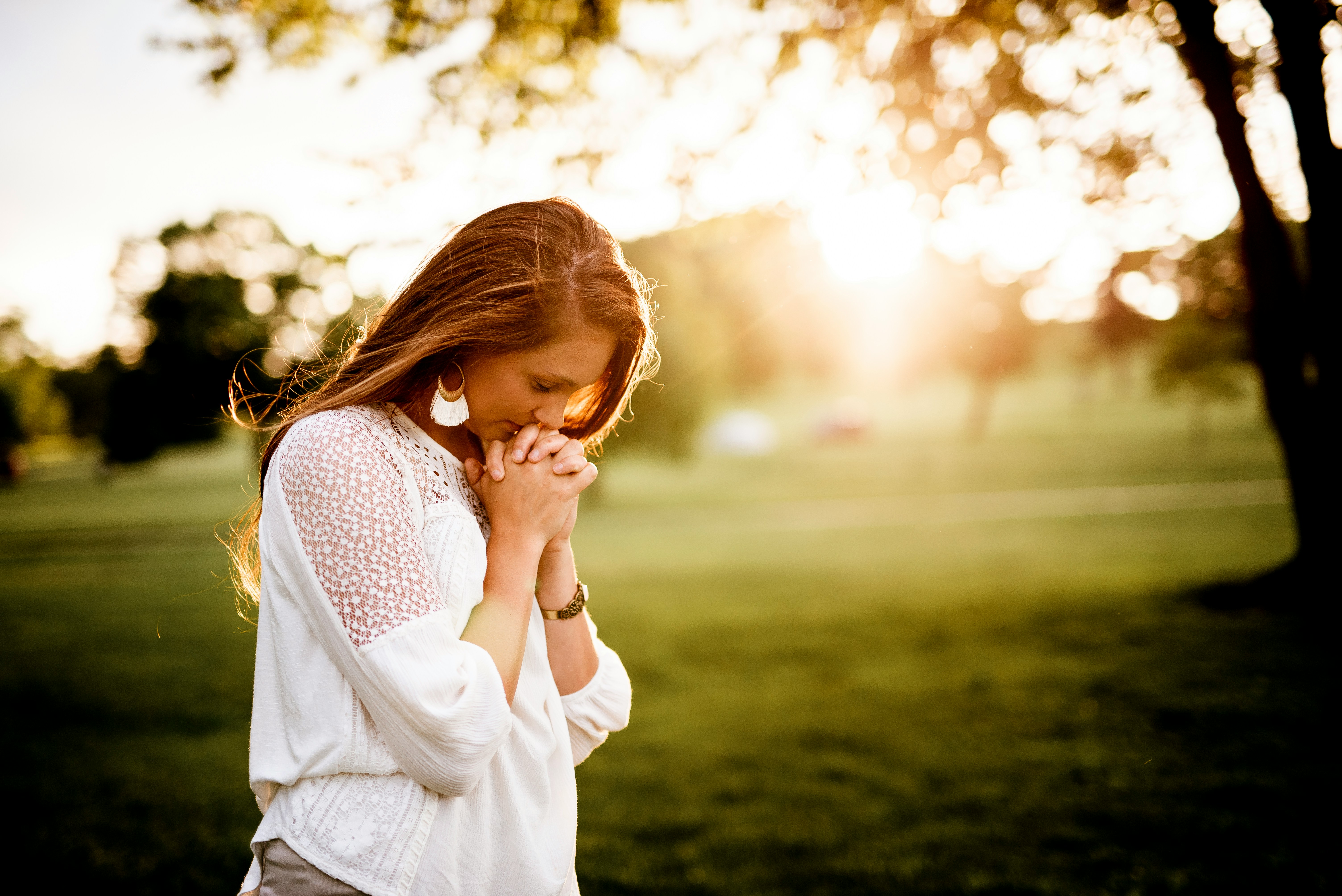 woman praying - Fall Church Outfits