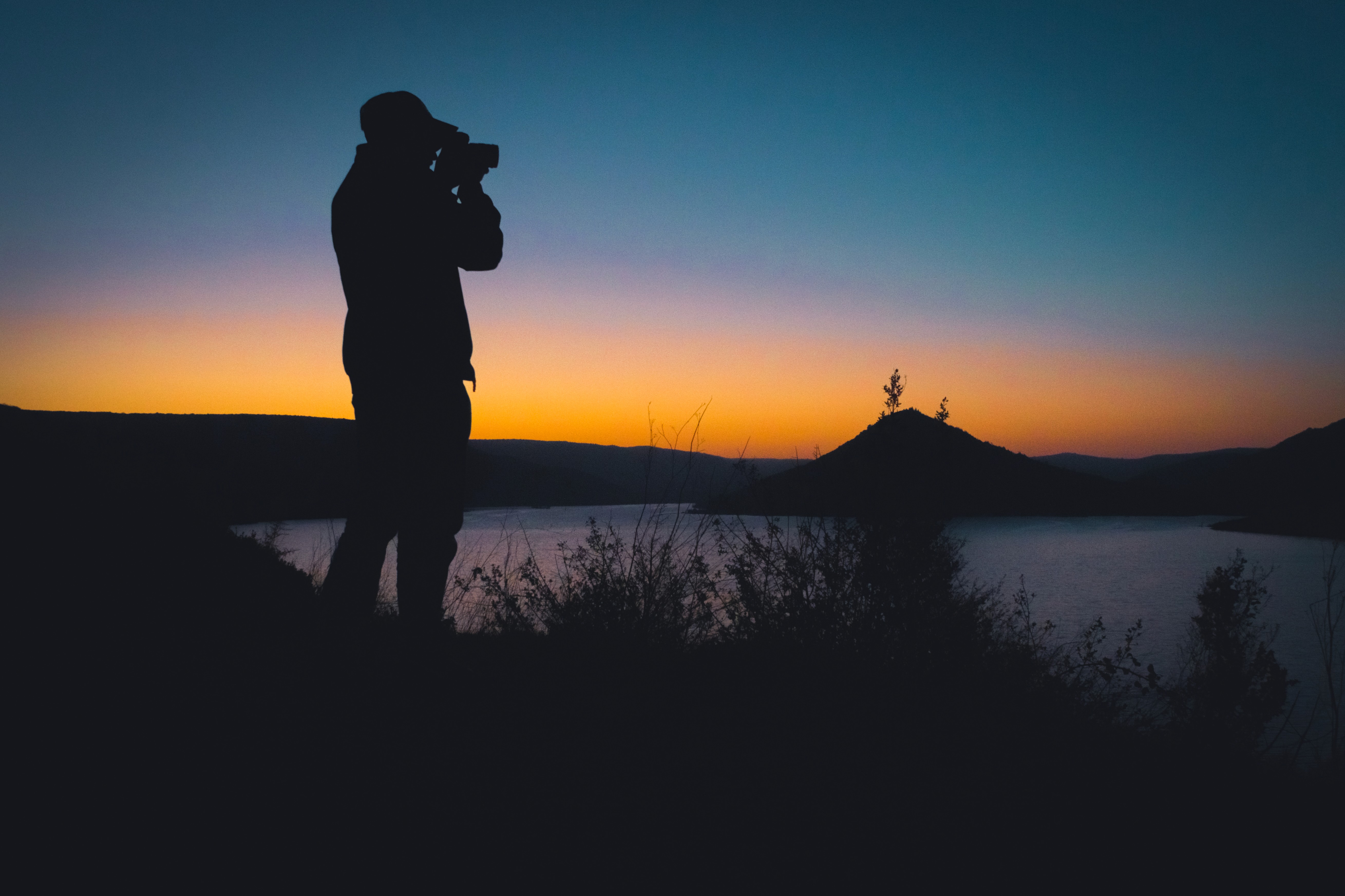 A team of professionals collaborates around a table, analyzing charts and graphs, showcasing teamwork and a productive work environment.