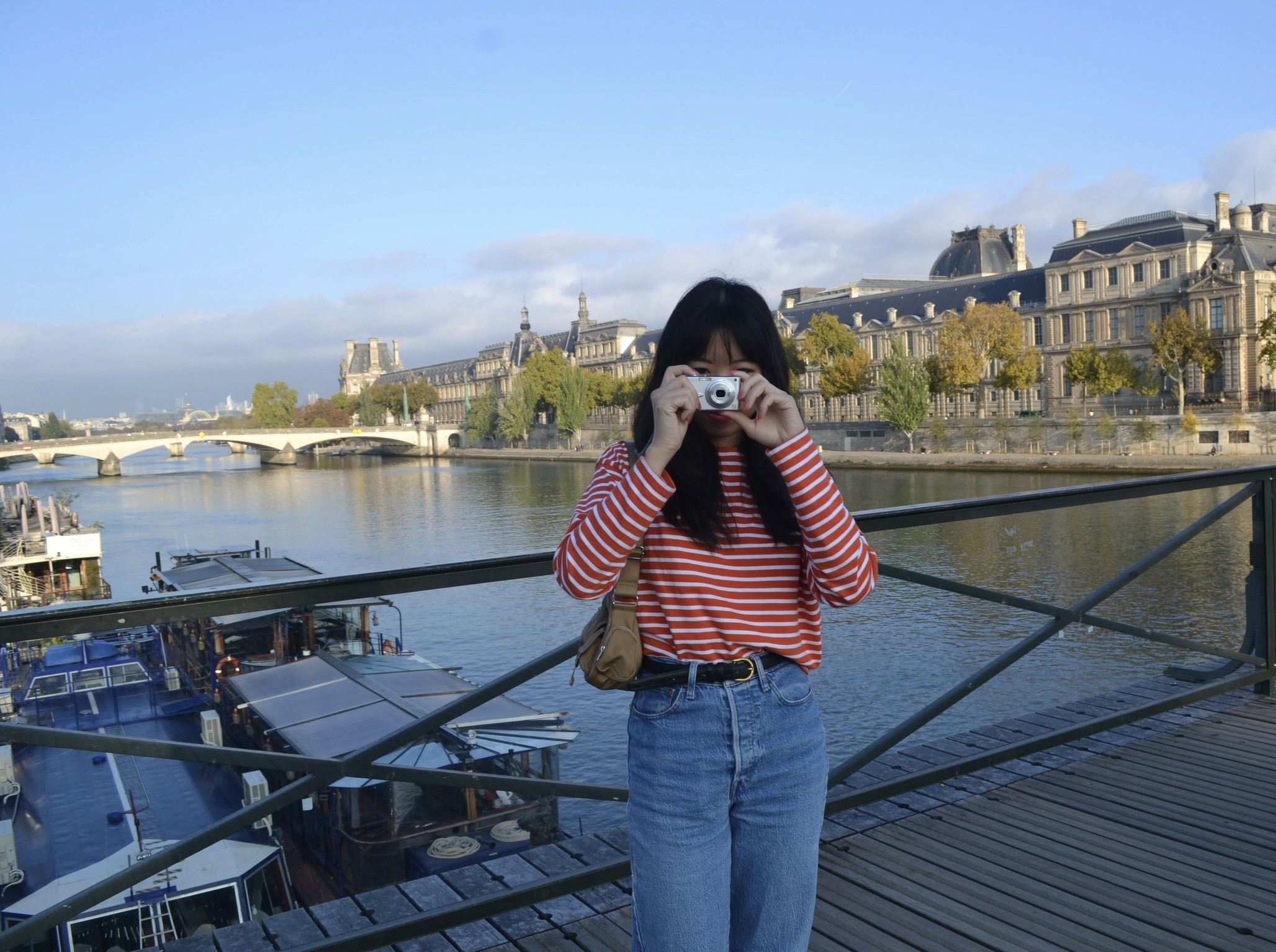 man filming on beach