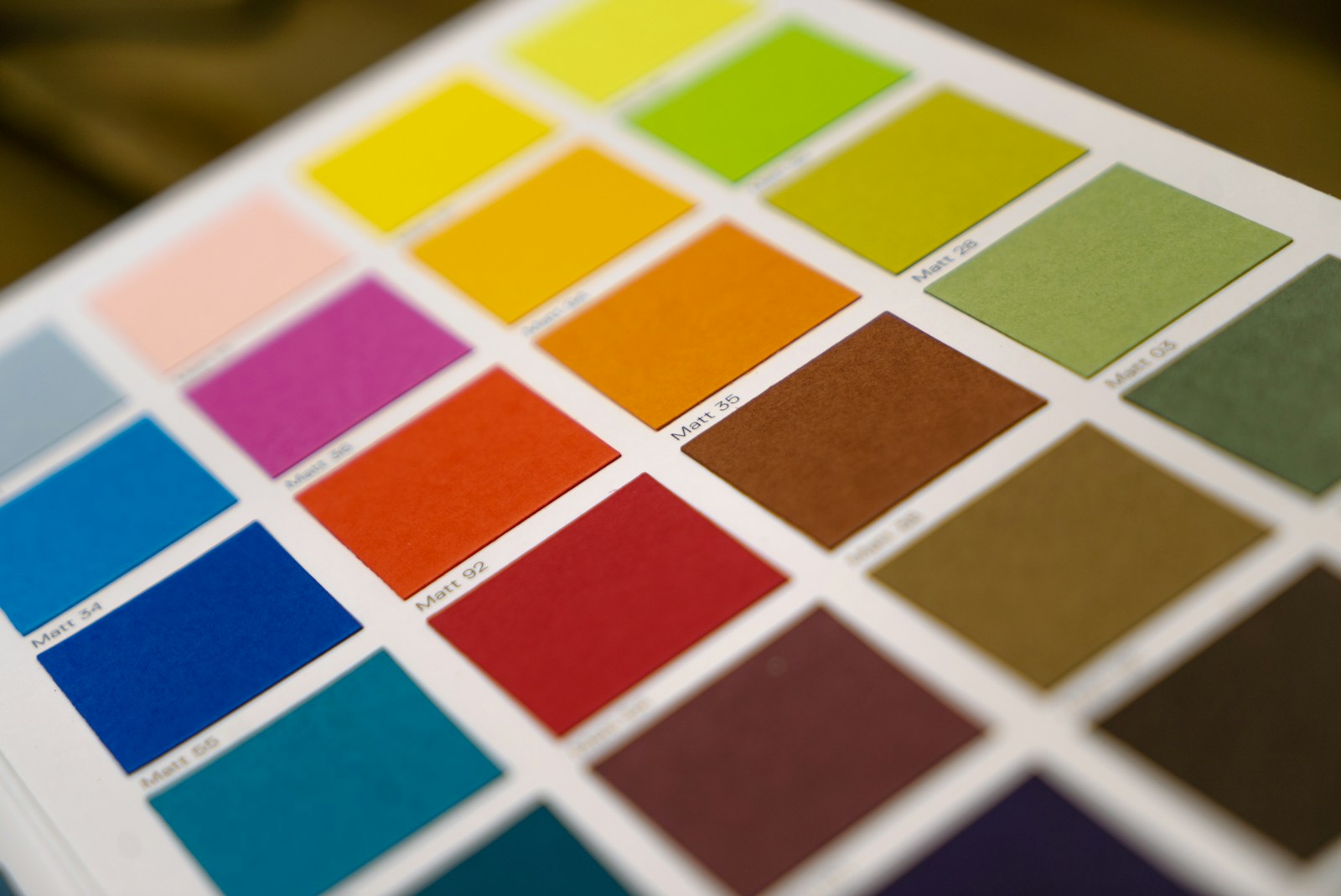 A bright arrangement of yellow, orange and blue colour swatches