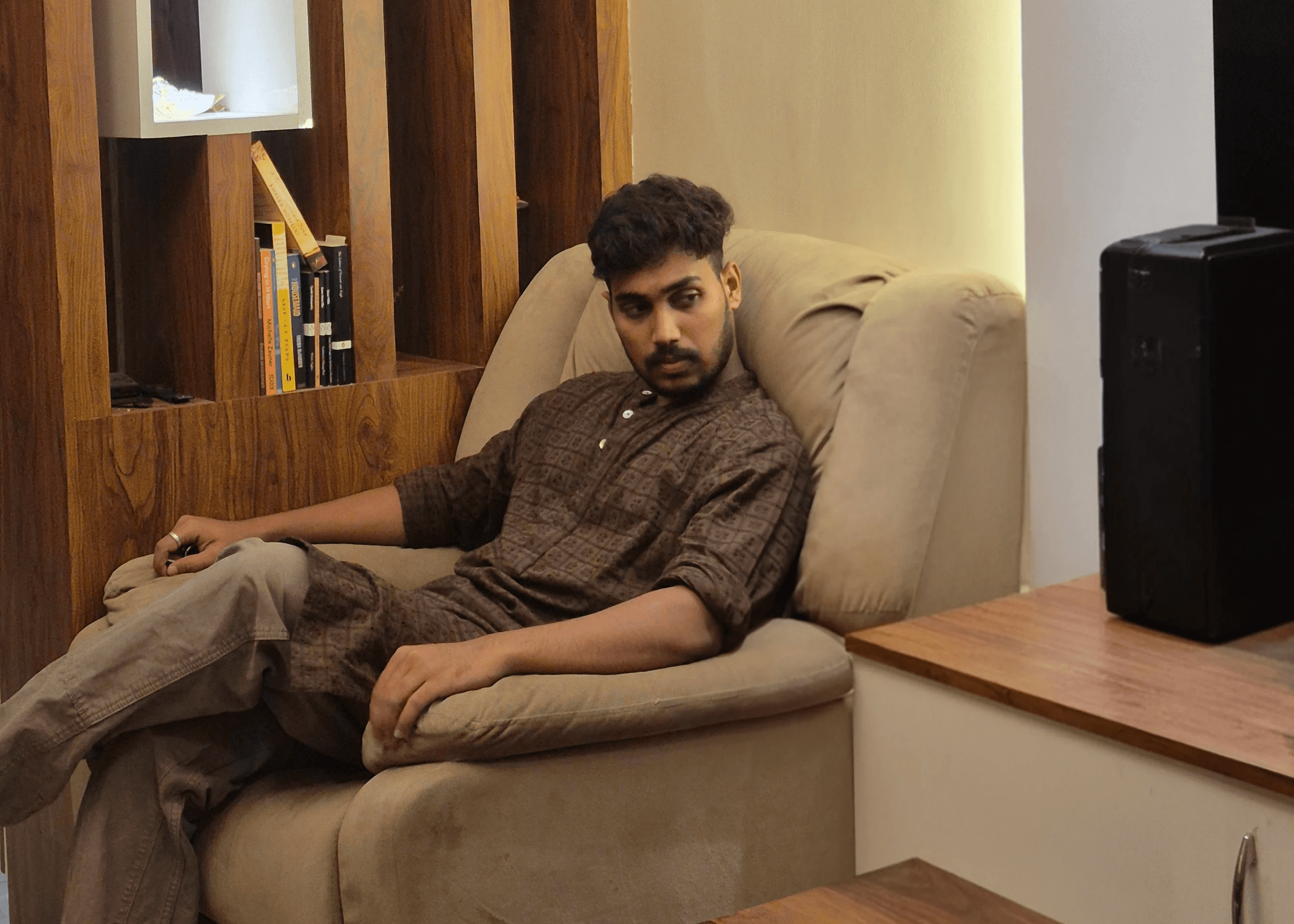 A boy in shorts and cap on his hat