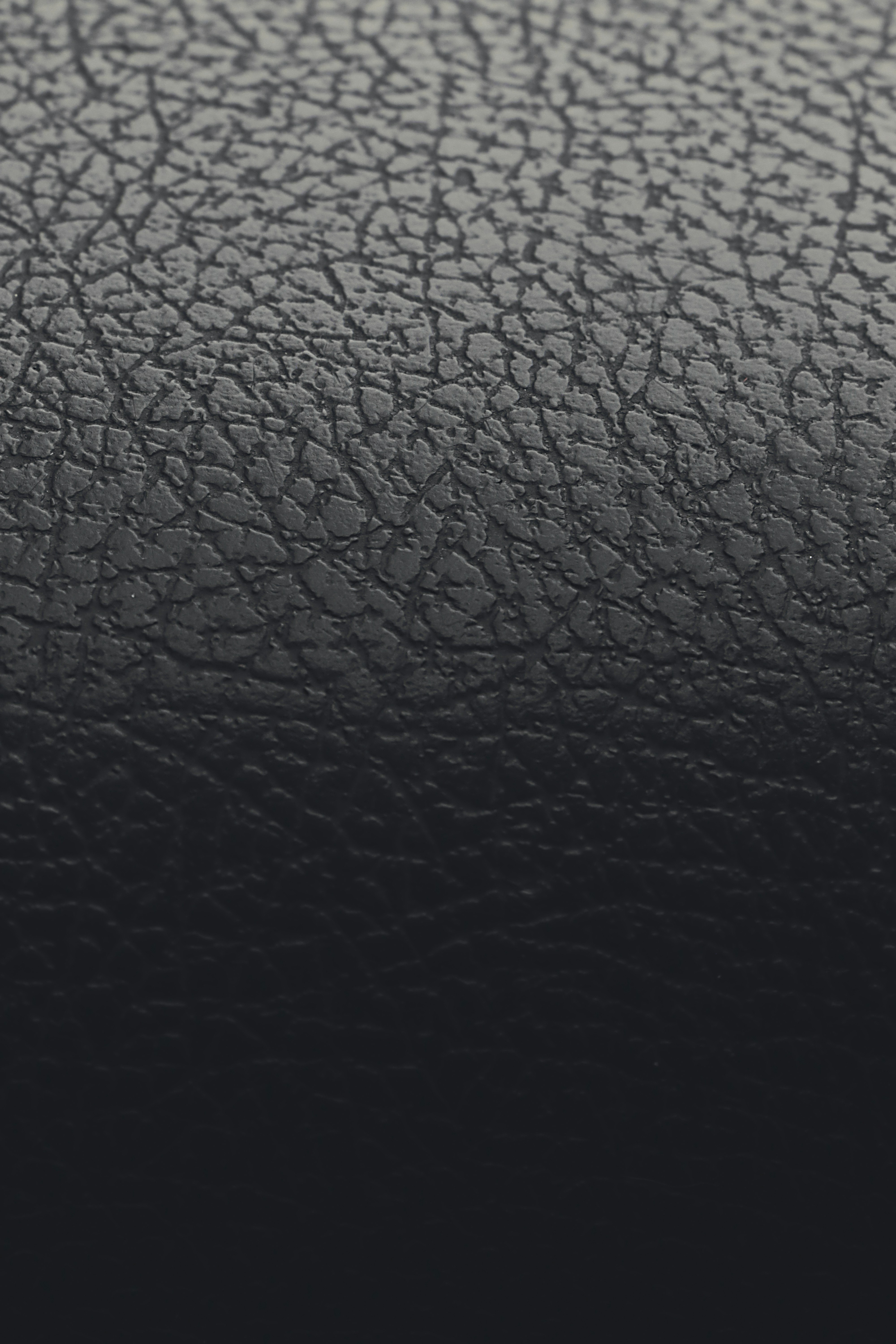 Close-up of textured, dark leather material.