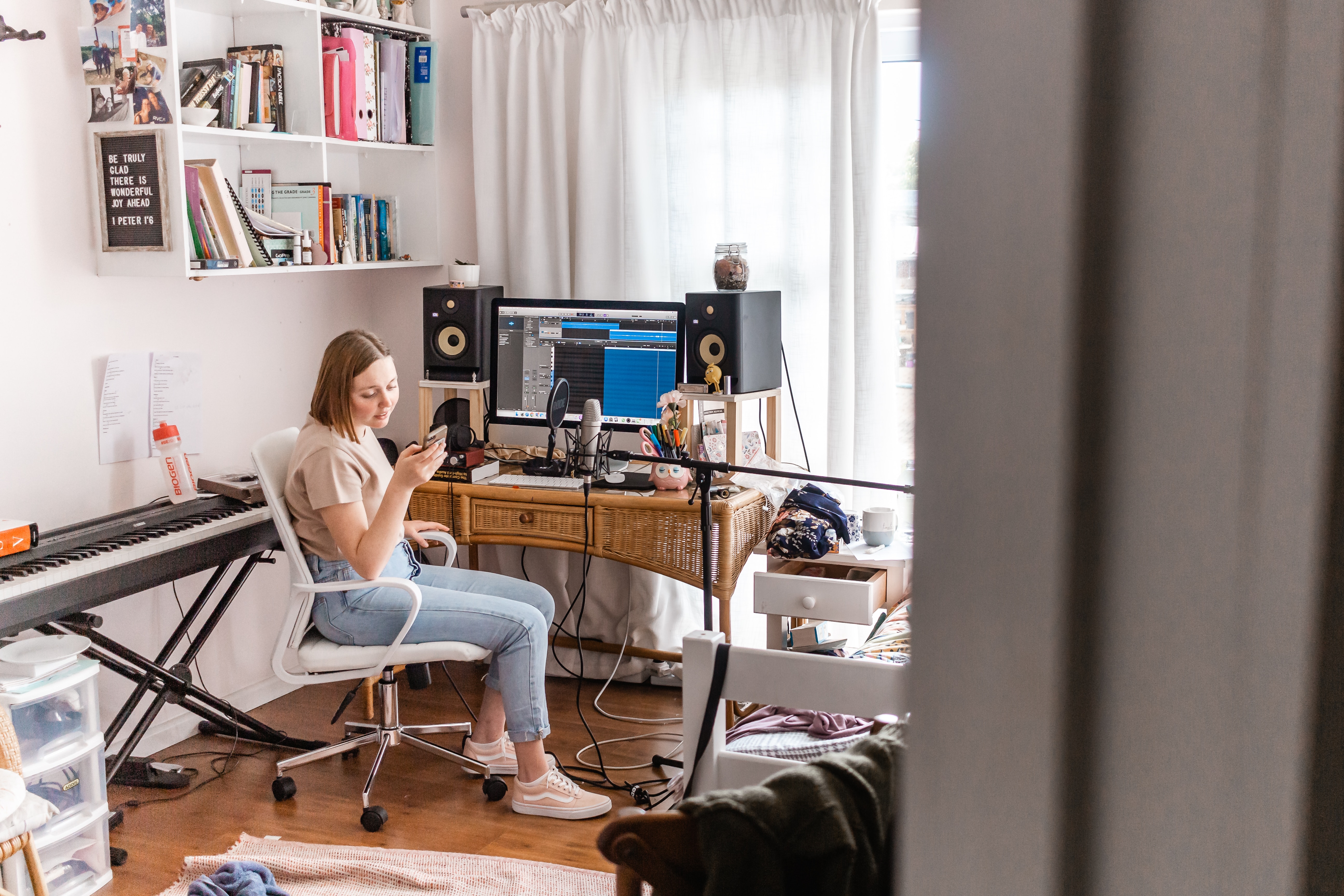Woman looking on her phone to hire a singer