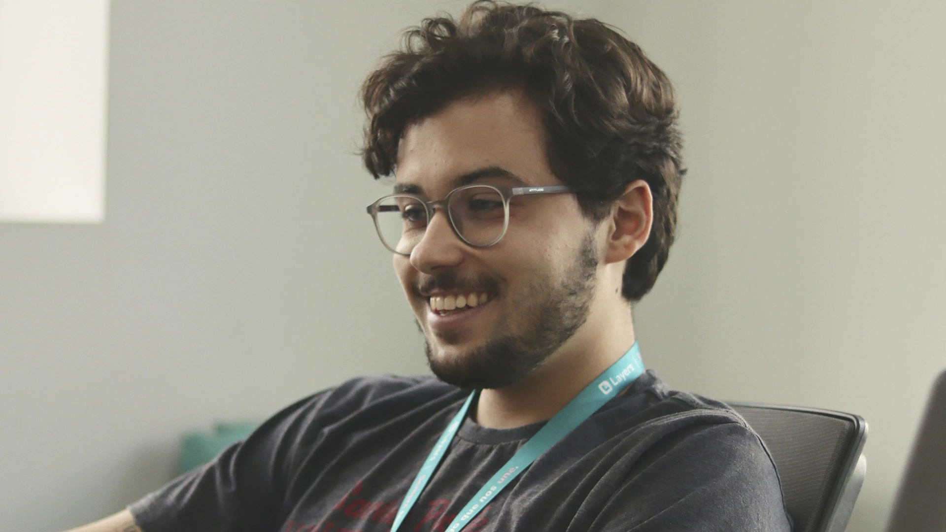 A man sitting in front of a laptop computer