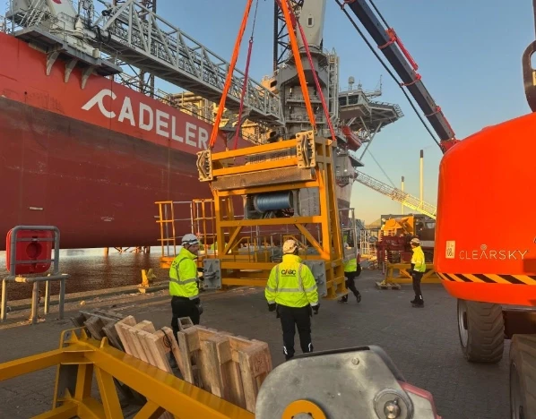 CASC personnel overseeing heavy lifting operations at a port using cranes and specialised lifting equipment.