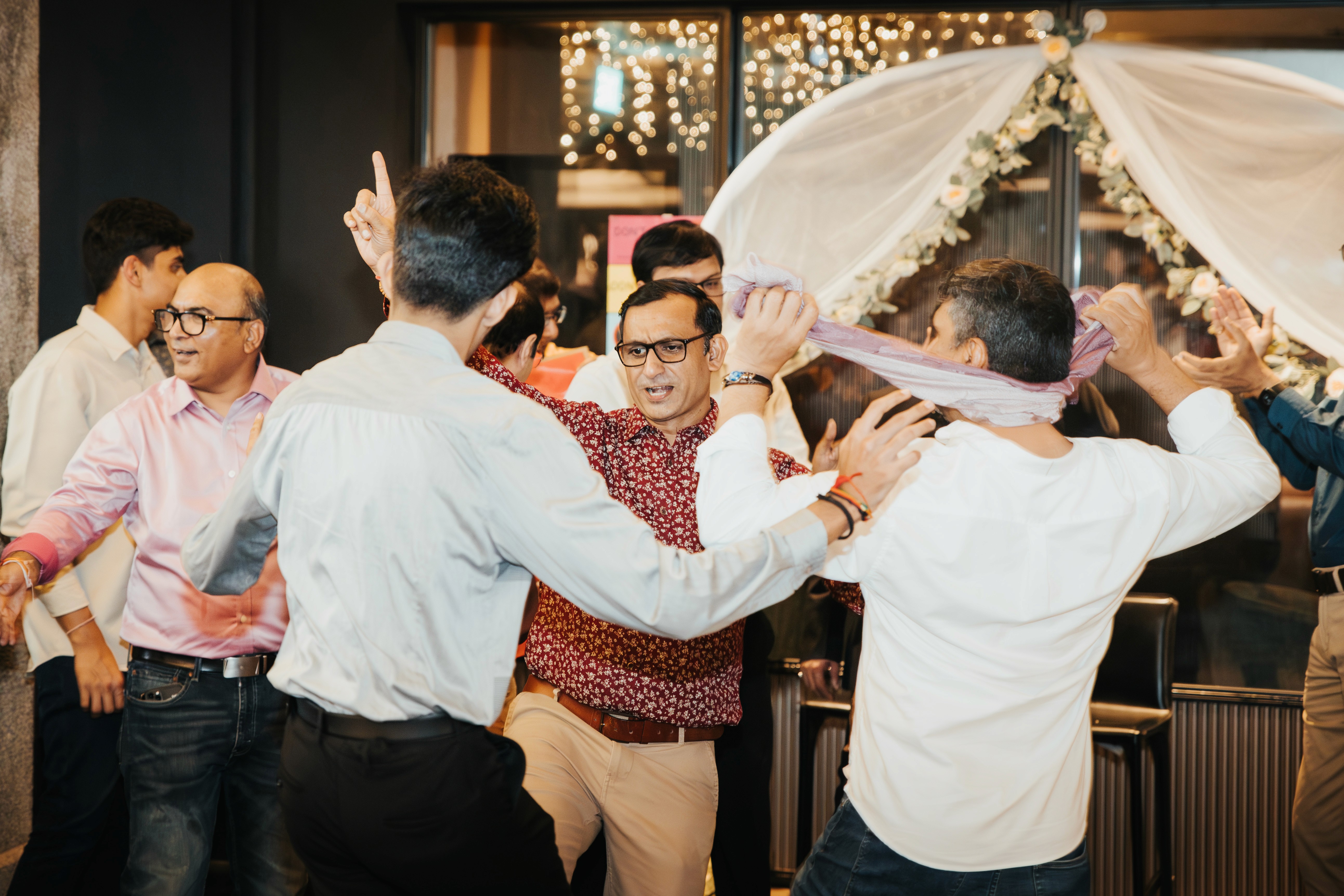 Lively celebration and dancing captured at a restaurant venue in Clarke Quay, Singapore.