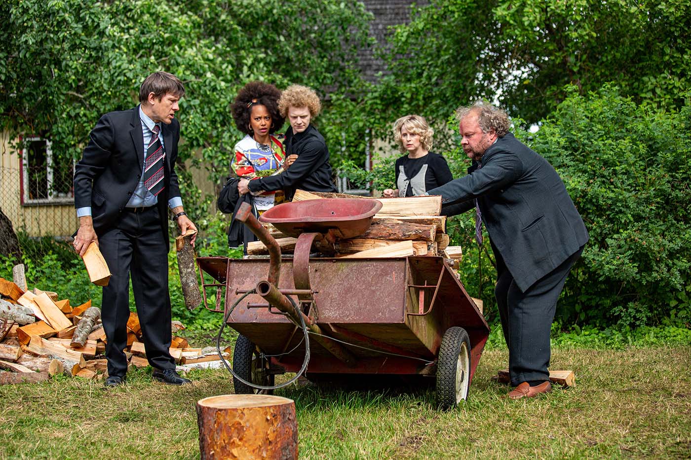 Scene from Estonian Funeral, showing a man drinking during a chaotic family gathering. A dark comedy about love, identity, and clashing generations in modern and traditional Estonia.