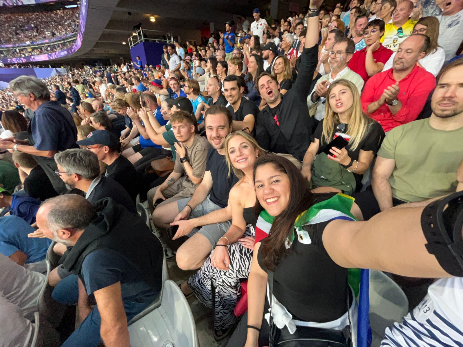 Group of people relaxing outdoors on a field or lawn