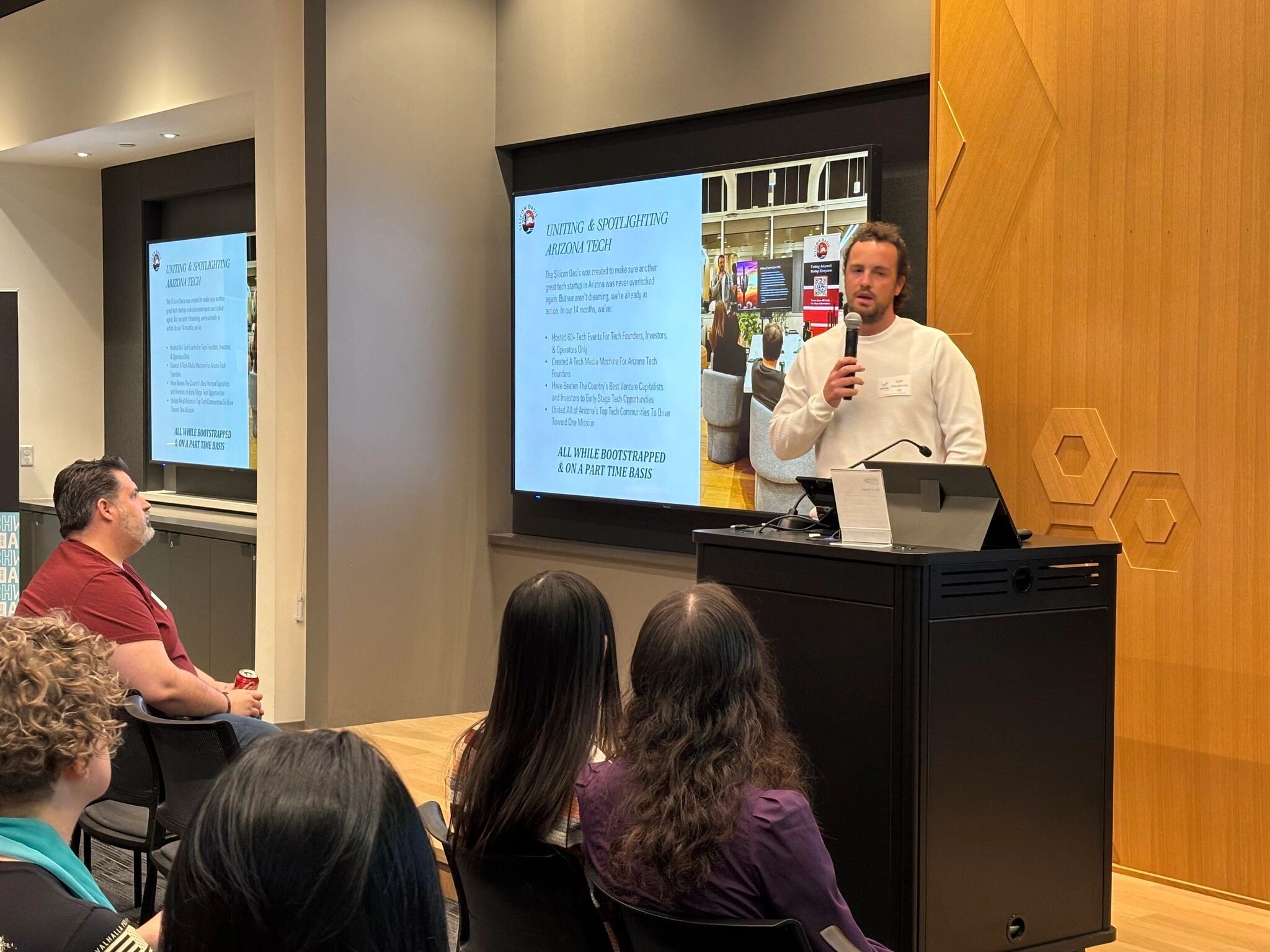 a black and white living room with a large tv