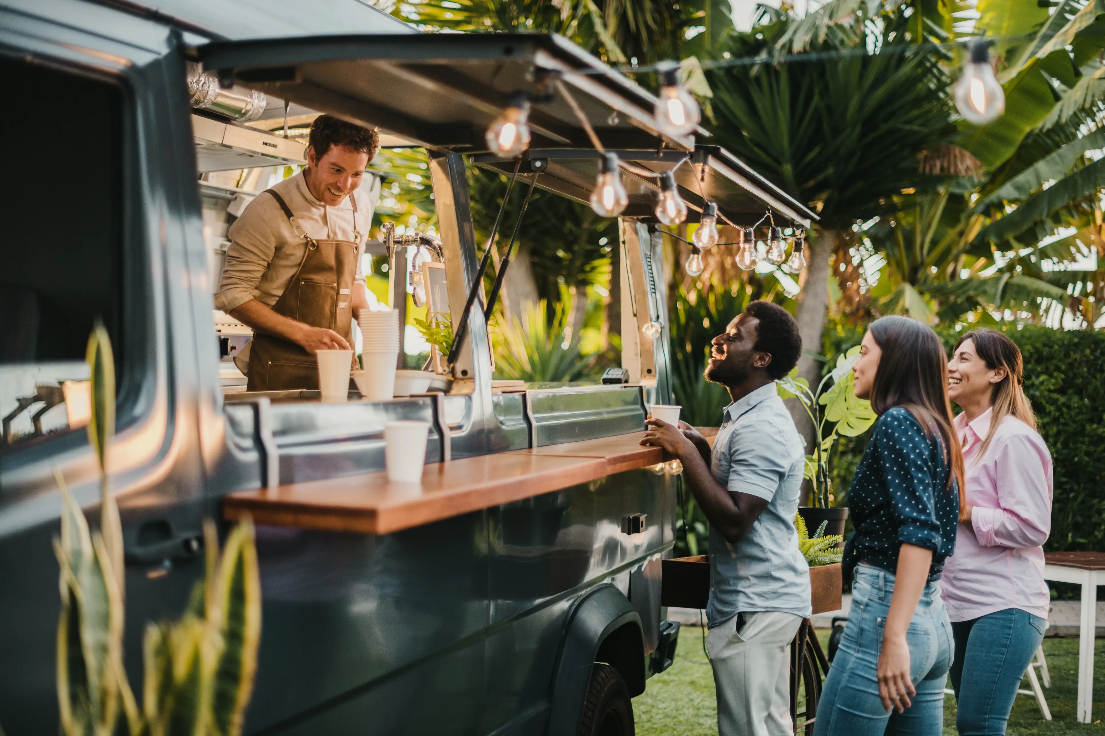 Small Food truck owner serving customers