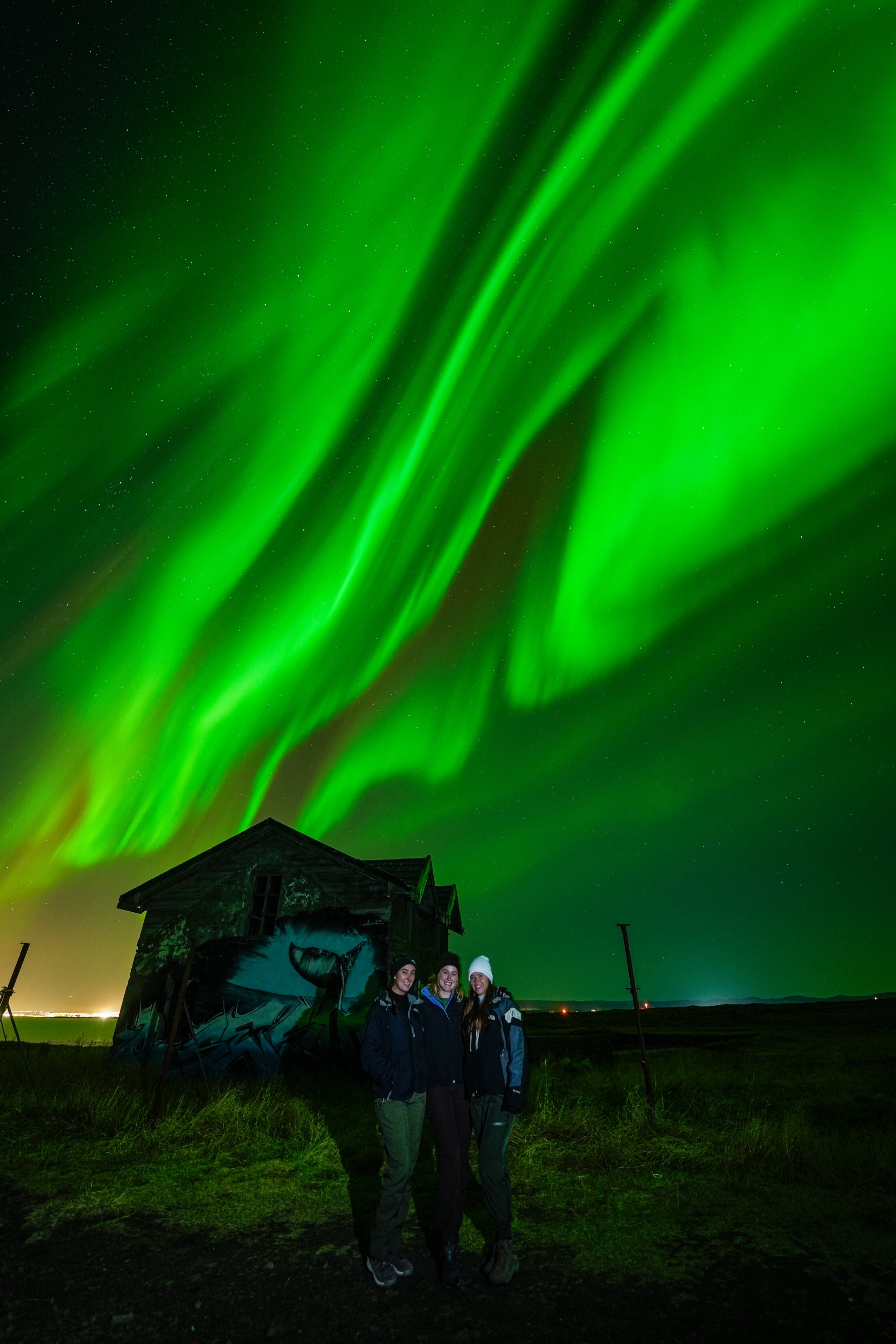 Northern Lights tour photography from Aurora Experts in Iceland, featuring guests beneath the aurora, winter landscapes, and vivid skies over remote Icelandic locations.