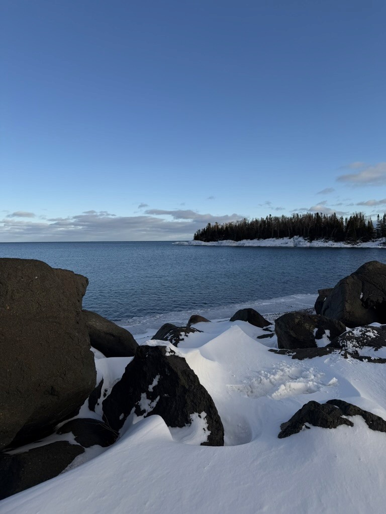 kids lying on a glass land and smiling
