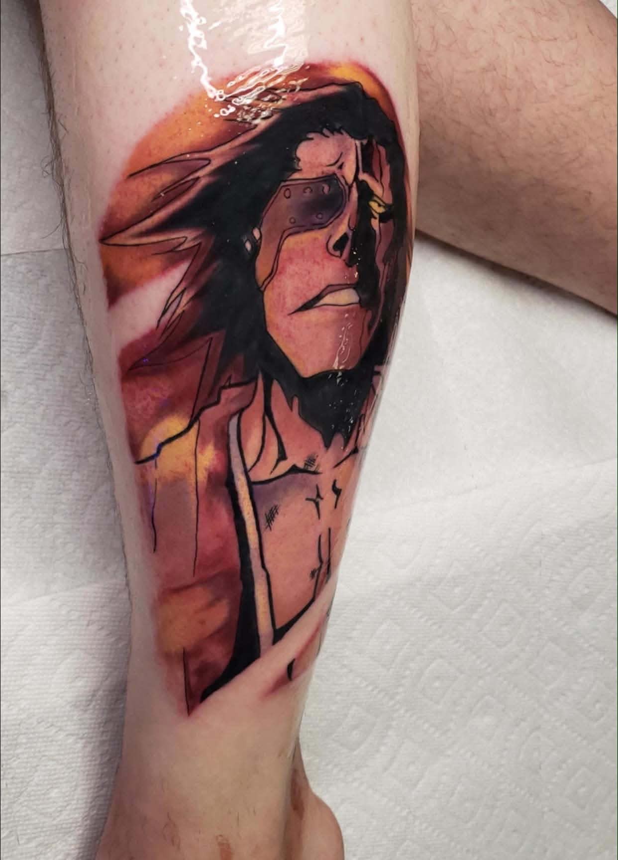 A forearm tattoo of Nezuko Kamado from Demon Slayer, depicted in a stylized anime art style. She is holding a sword.