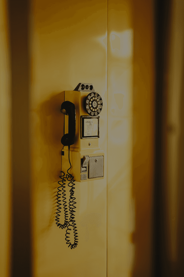 Silhouette of a person standing in front of colorful, flowing abstract light patterns.