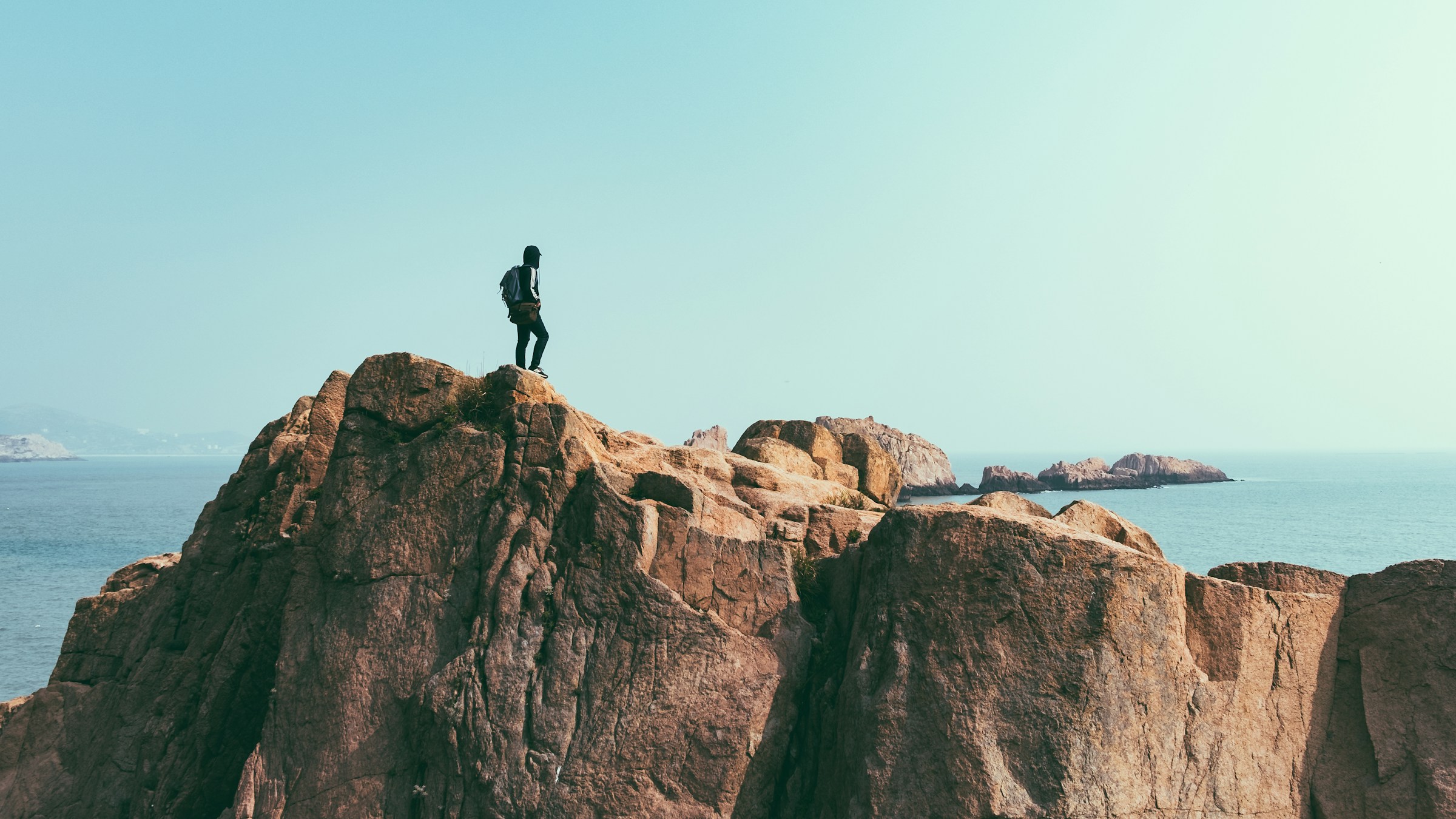 person on top of a mountain - Fall hiking outfit