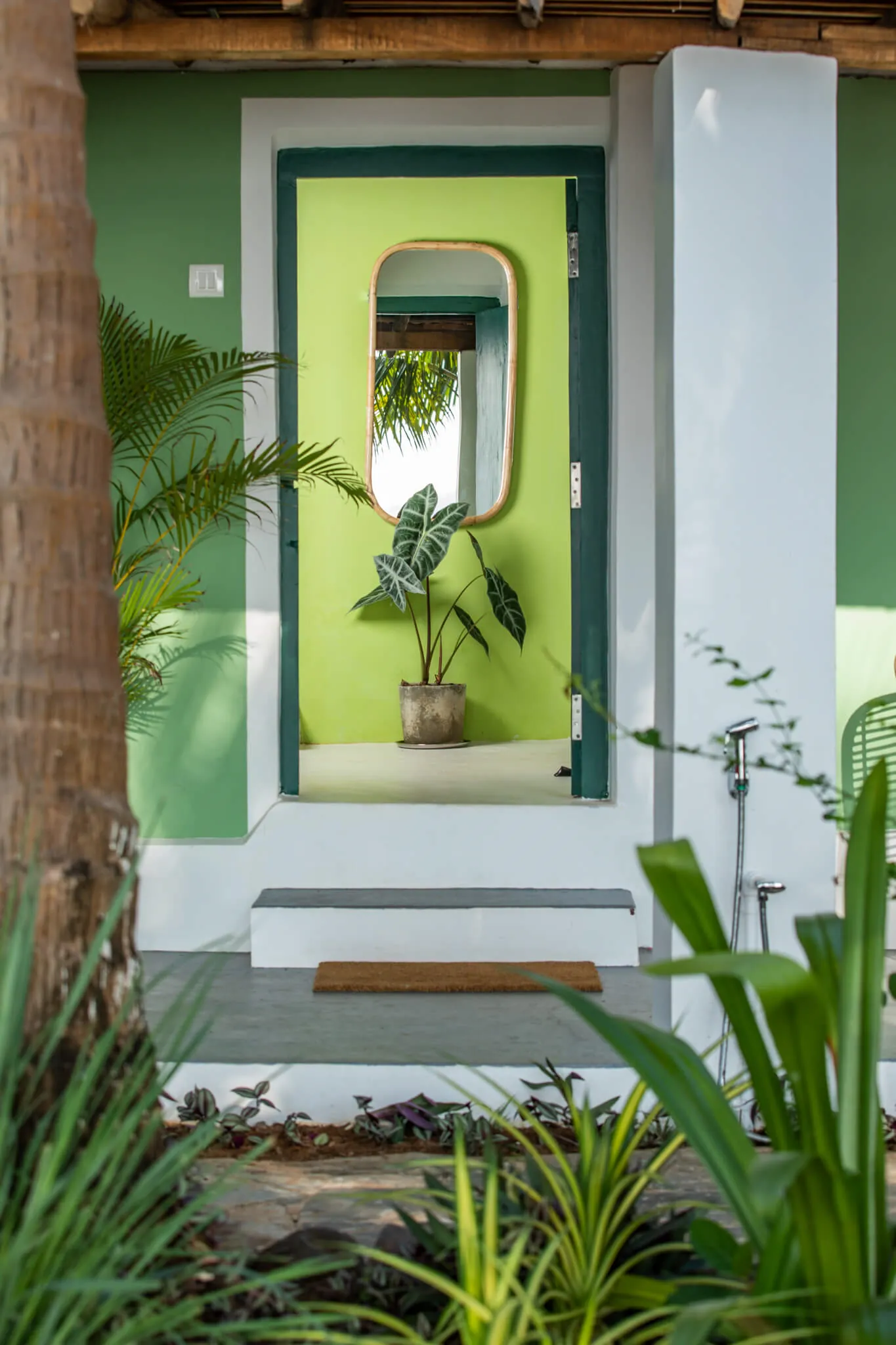 Green-framed entrance to a Casa Jaali room