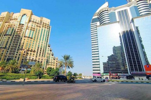 Street view of the SIT Tower entrance and surrounding infrastructure in the heart of Silicon Oasis.