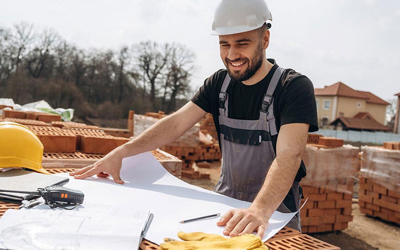 Two men looking at a laptop together