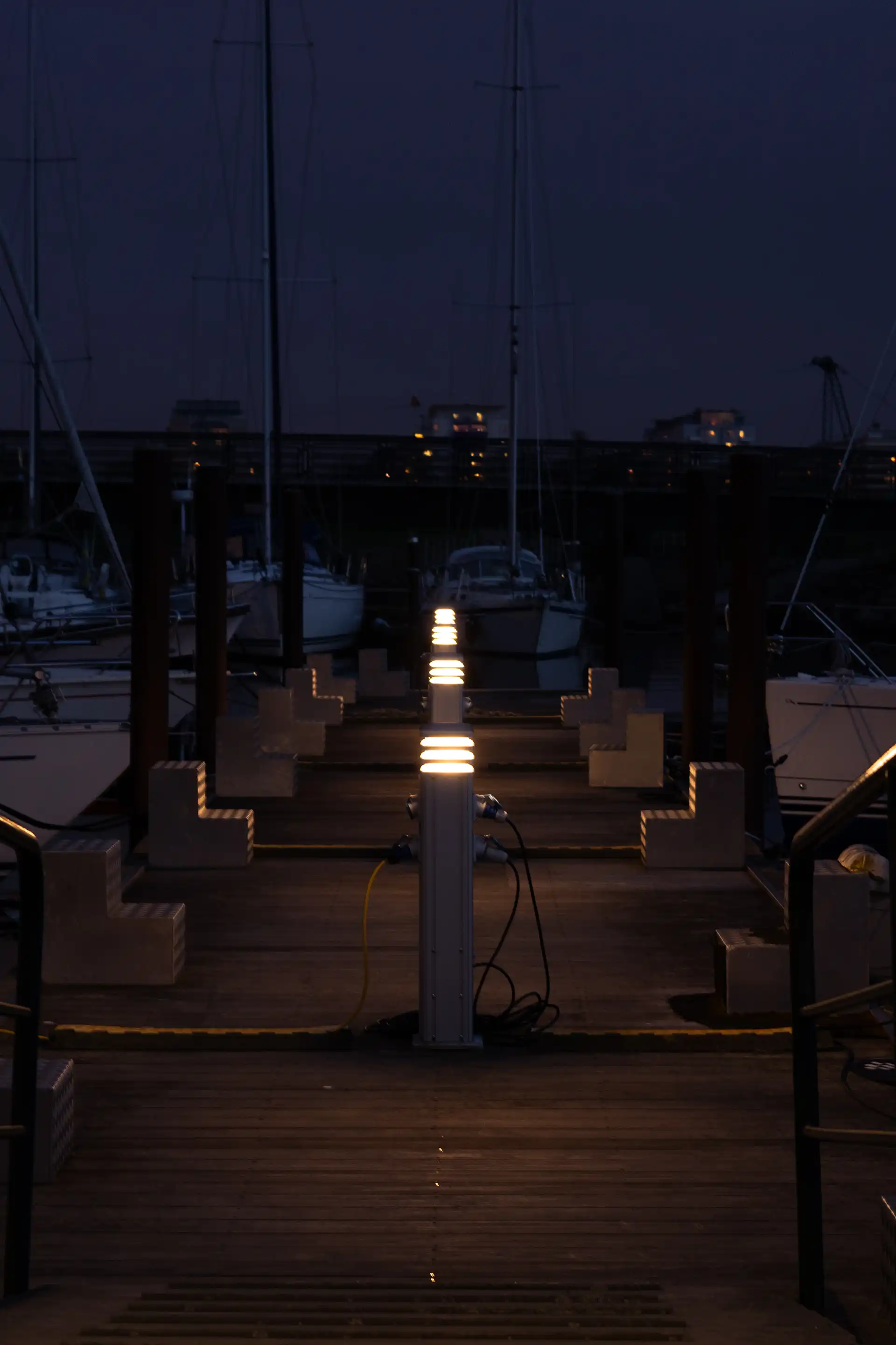 Multiple lamps in a silver colour on a wooden pier 