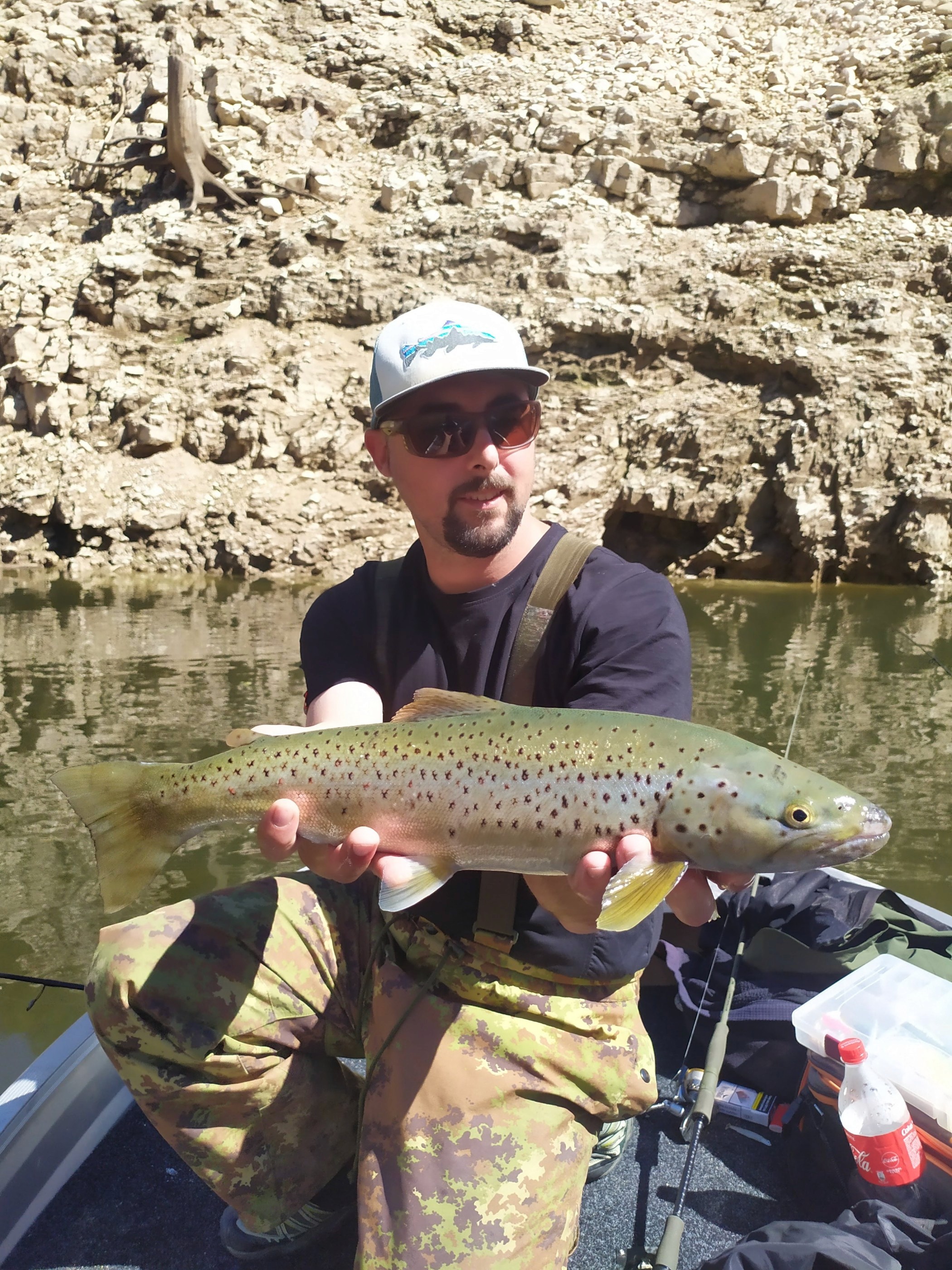 Catch and release of a powerful Lake Trout in the clear waters of Lake Santa Giustina.