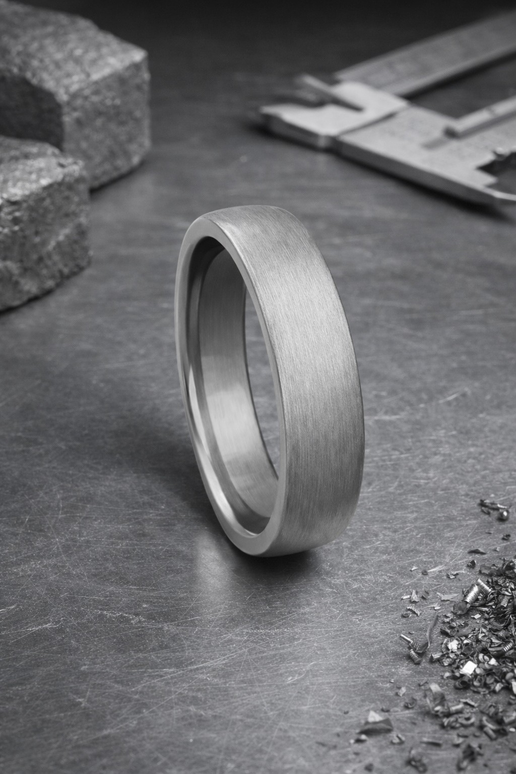 A ring reflects an eye.